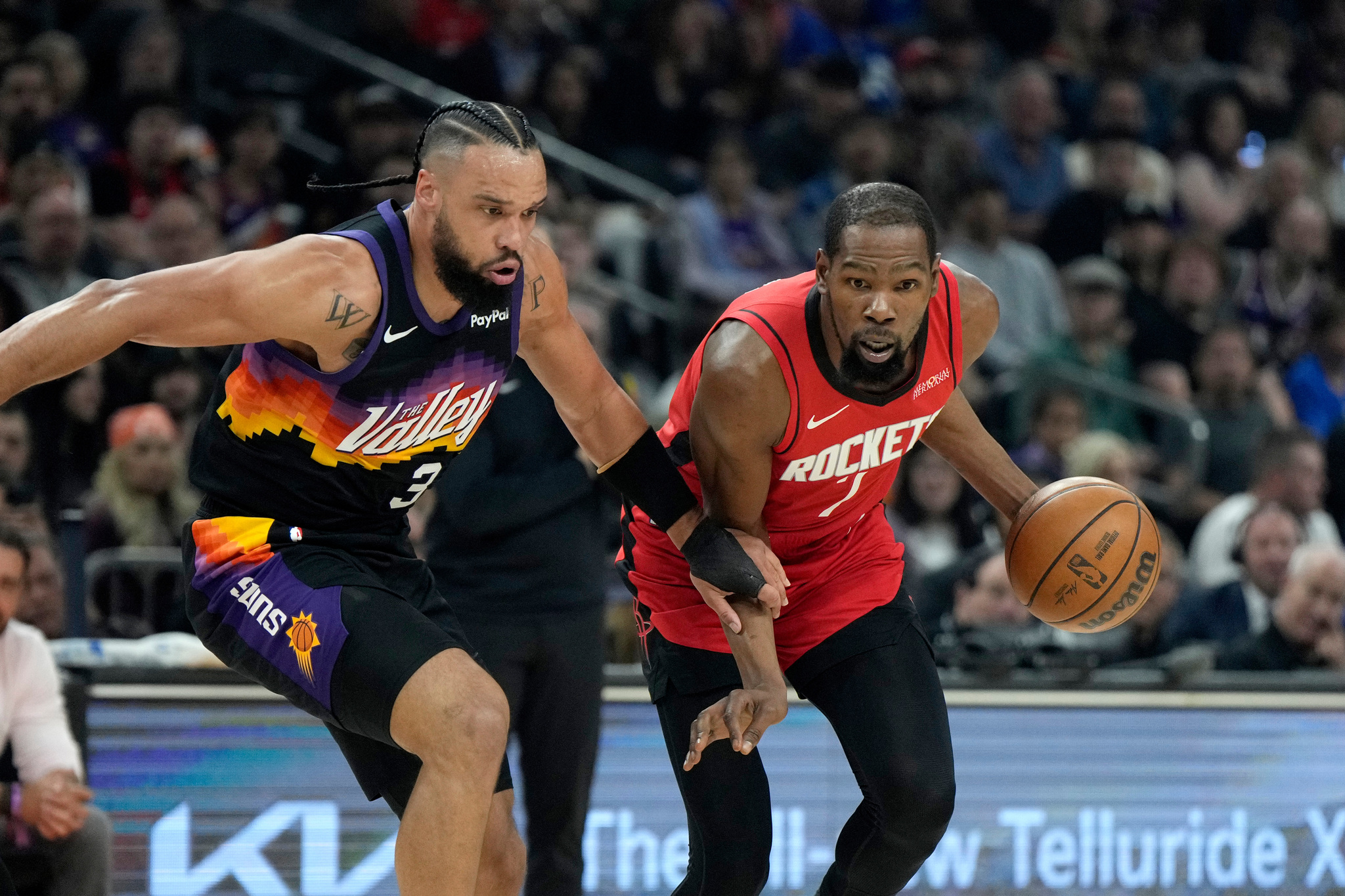 Houston Rockets forward lt;HIT gt;Kevin lt;/HIT gt; lt;HIT gt;Durant lt;/HIT gt;, right, dribbles the ball against Phoenix Suns forward Dillon Brooks (3) during the first half of an NBA basketball game, Tuesday, April 7, 2026, in Phoenix. (AP Photo/Ross D. Franklin)
