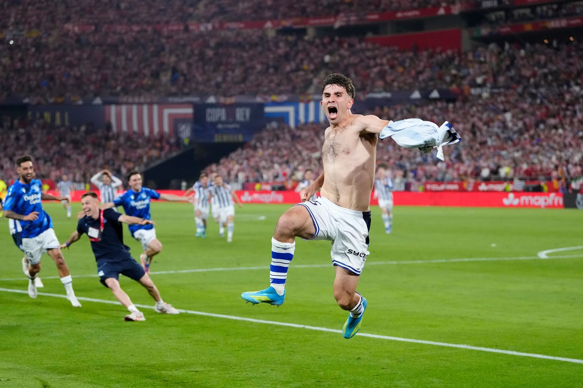 Real Sociedad's Pablo Marin, right, celebrates with teammates as they won the Copa del Rey final.