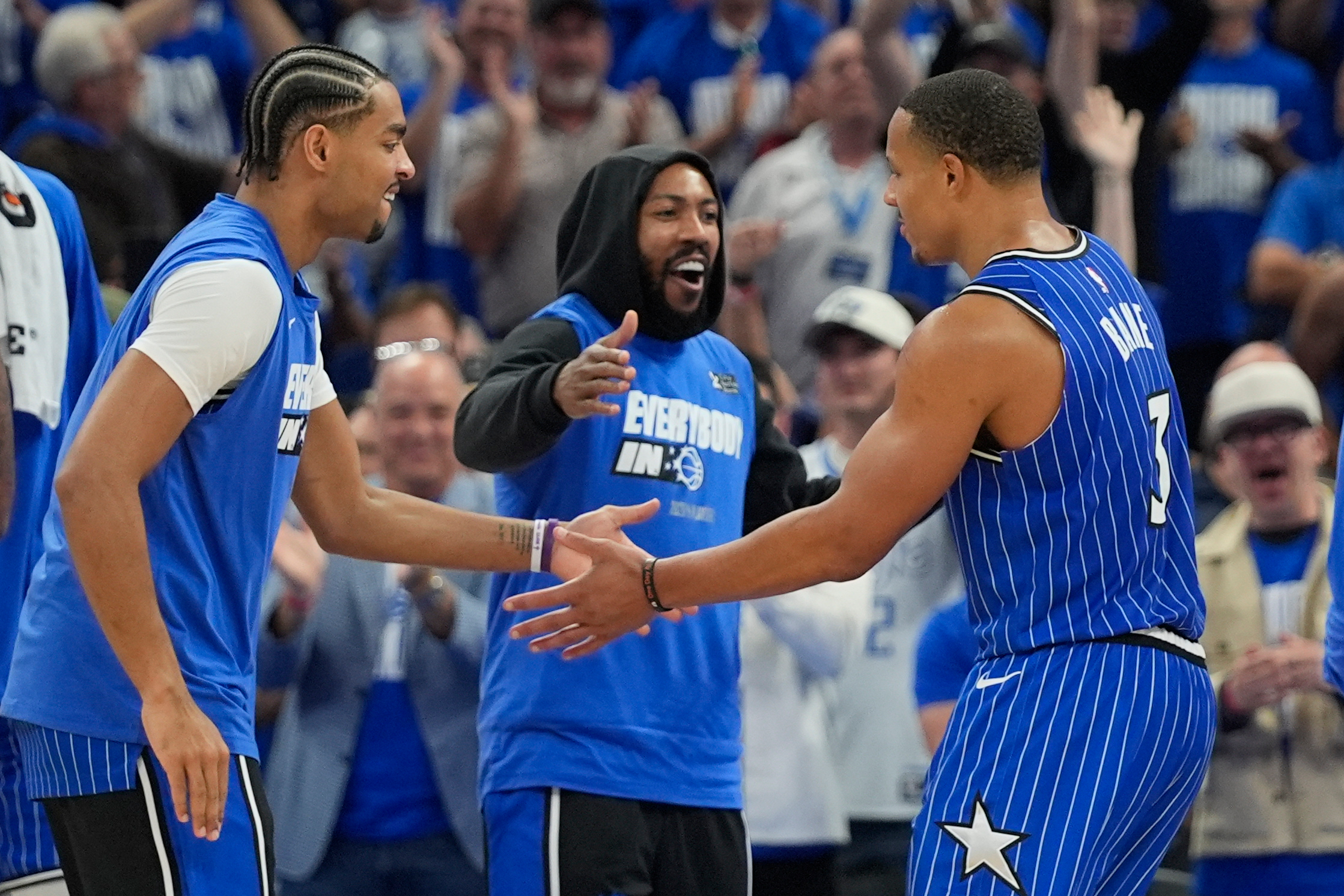 Orlando Magic guard Desmond Bane, right, celebrates with teammates guard Jett Howard, left, and guard Jase Richardson, center, during the second half in Game 4 of a first-round NBA basketball playoff series, Monday, April 27, 2026, in Orlando, Fla. (AP Photo/John Raoux)