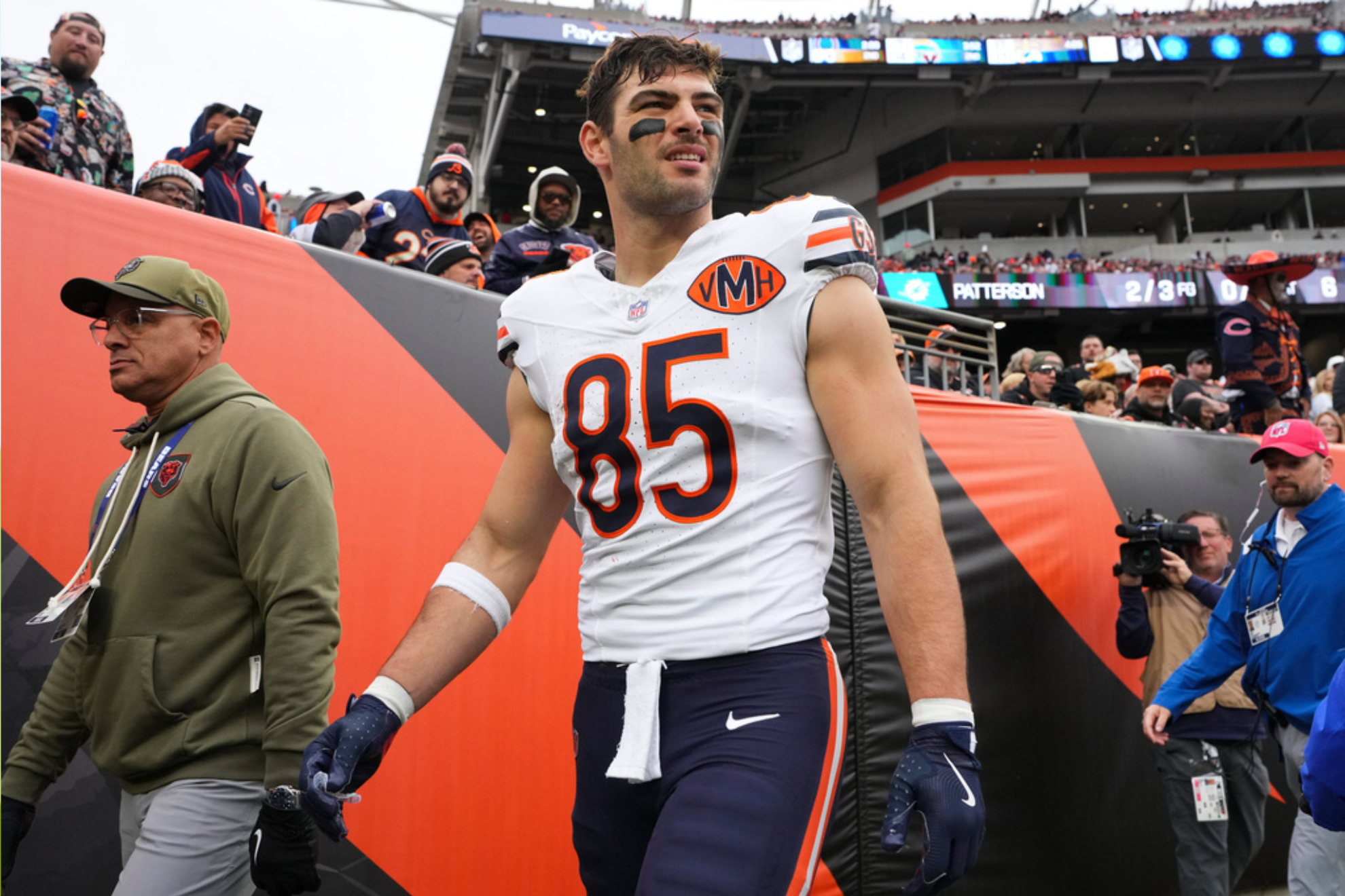 Chicago Bears tight end Cole Kmet (85) leaves the game with an injury during the first half of an NFL football game
