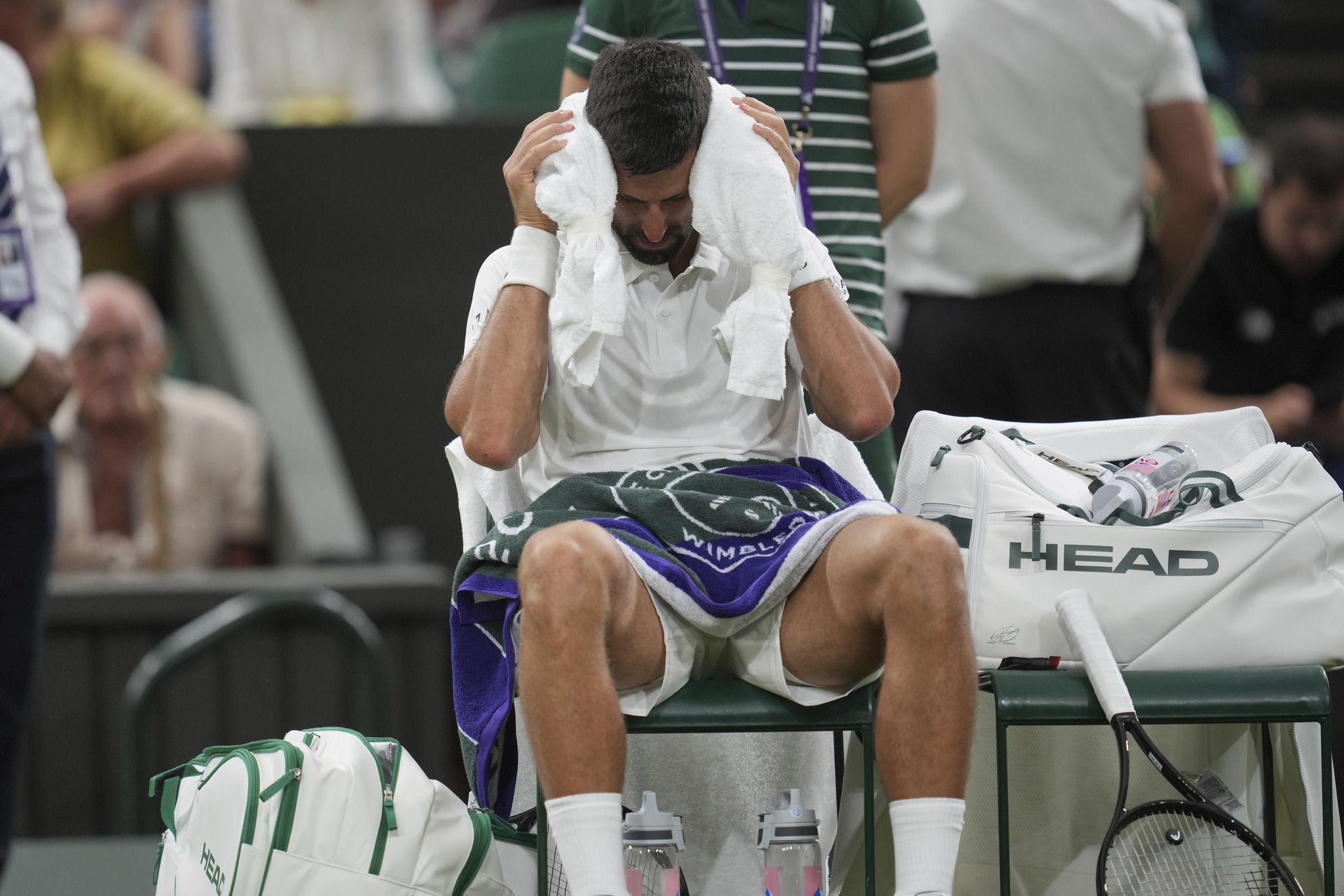Novak Djokovic felt unwell during his Wimbledon first-round match before winning in four sets. (AP Photo/Kin Cheung)