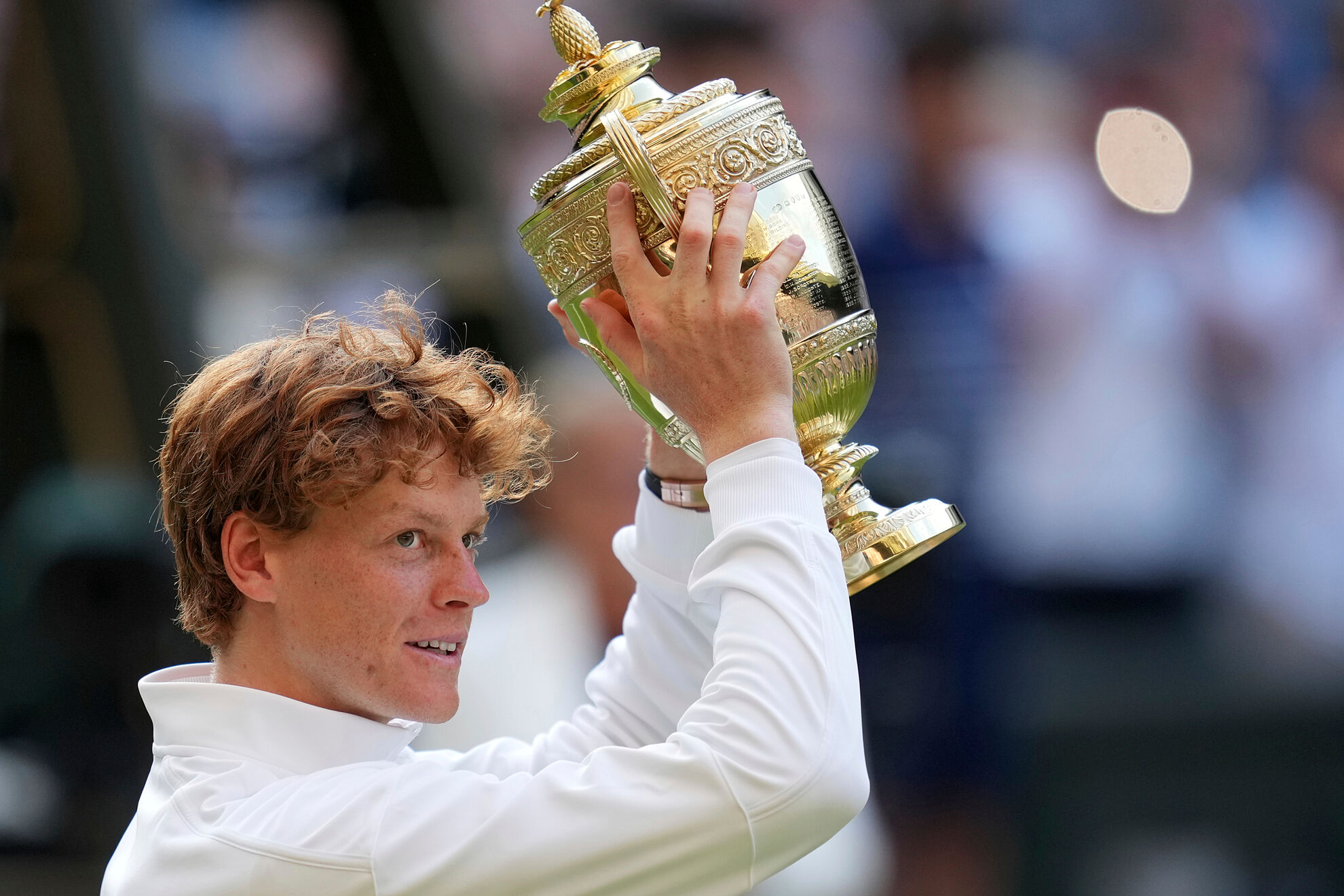 Italy's Jannik lt;HIT gt;Sinner lt;/HIT gt; celebrates with the trophy after beating Carlos Alcaraz of Spain to win the men's singles final at the Wimbledon Tennis Championships in London, Sunday, July 13, 2025. (AP Photo/Kin Cheung)