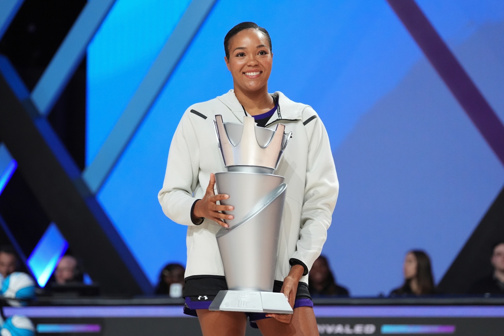 Napheesa Collier accepting the Unrivaled MVP trophy in 2025.