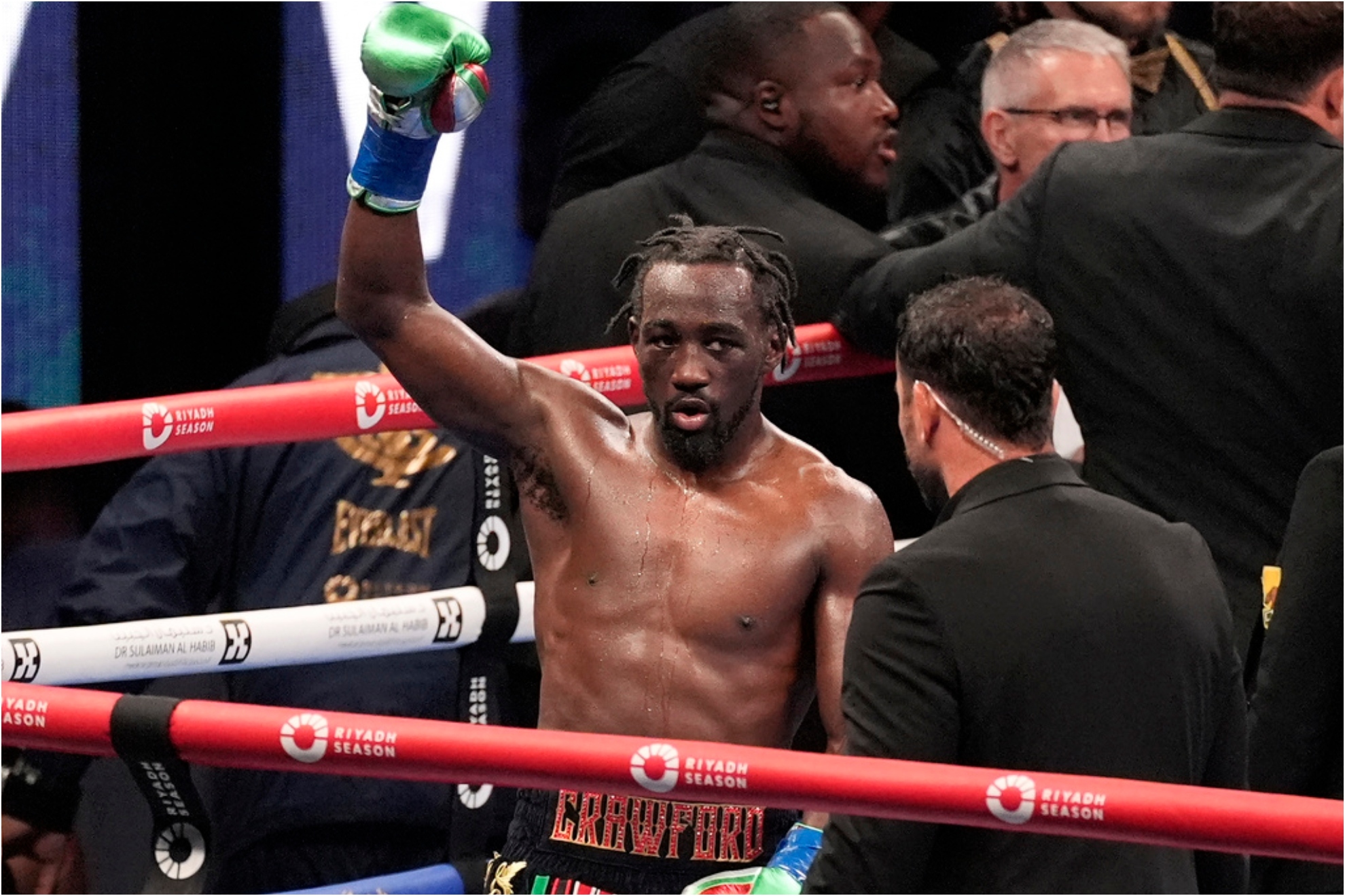 Crawford raises his fist as at the end of the 12 round fight against Madrimov.