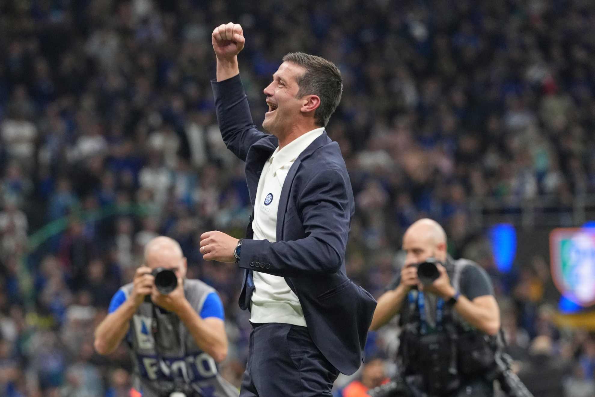 Inter Milan's head coach Cristian Chivu celebrates their victory at the Serie A soccer match between Inter Milan and Parma, in Milan, Italy, Sunday, May 3, 2026. (AP Photo/Luca Bruno)