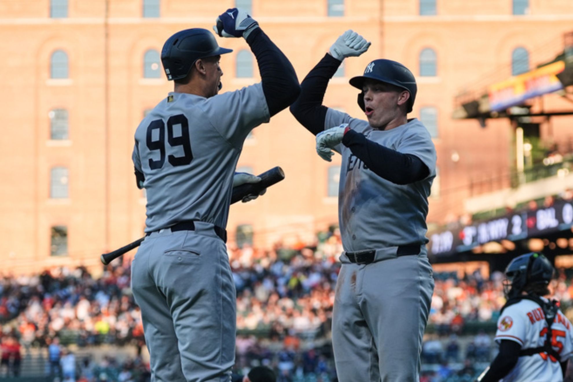 New York Yankees' Ben Rice, center right, celebrates with Aaron Judge (99).