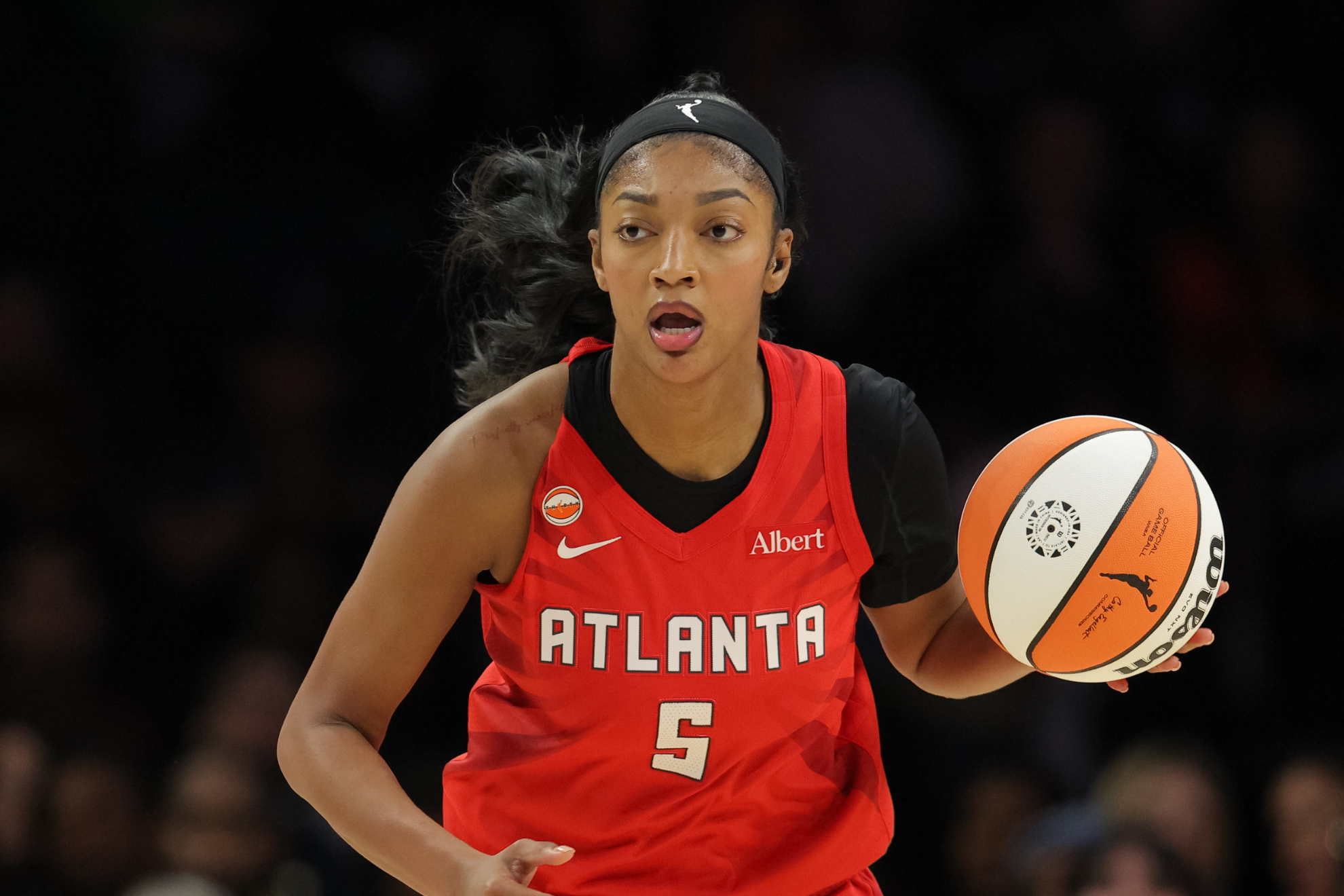Atlanta Dream forward Angel Reese (5) dribbles up the court during a WNBA basketball against the Minnesota Lynx, in Minneapolis, Saturday, May 9, 2026.