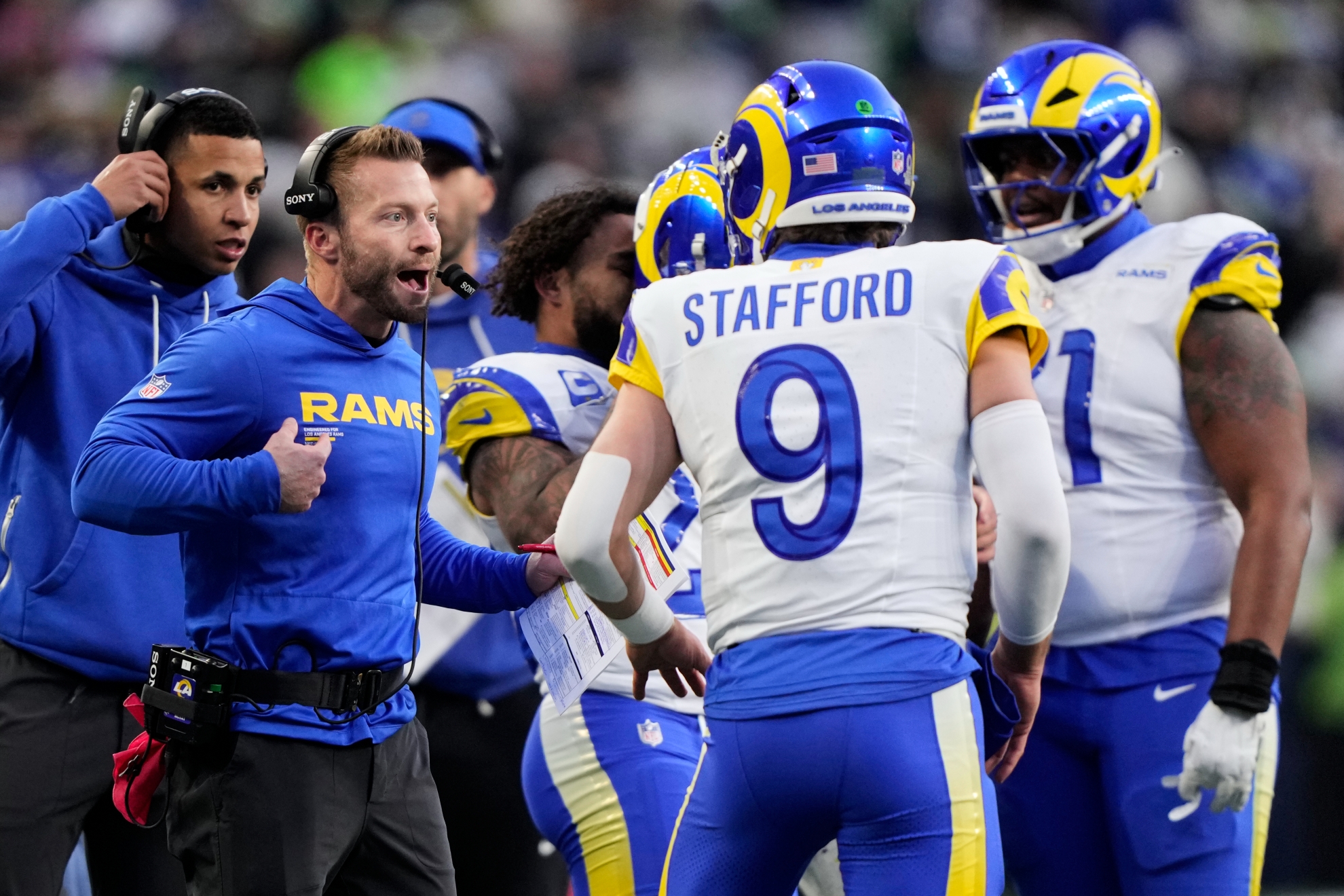 Los Angeles Rams head coach Sean McVay talks to quarterback Matthew Stafford (9) during the NFC Championship game against the Seattle Seahawks