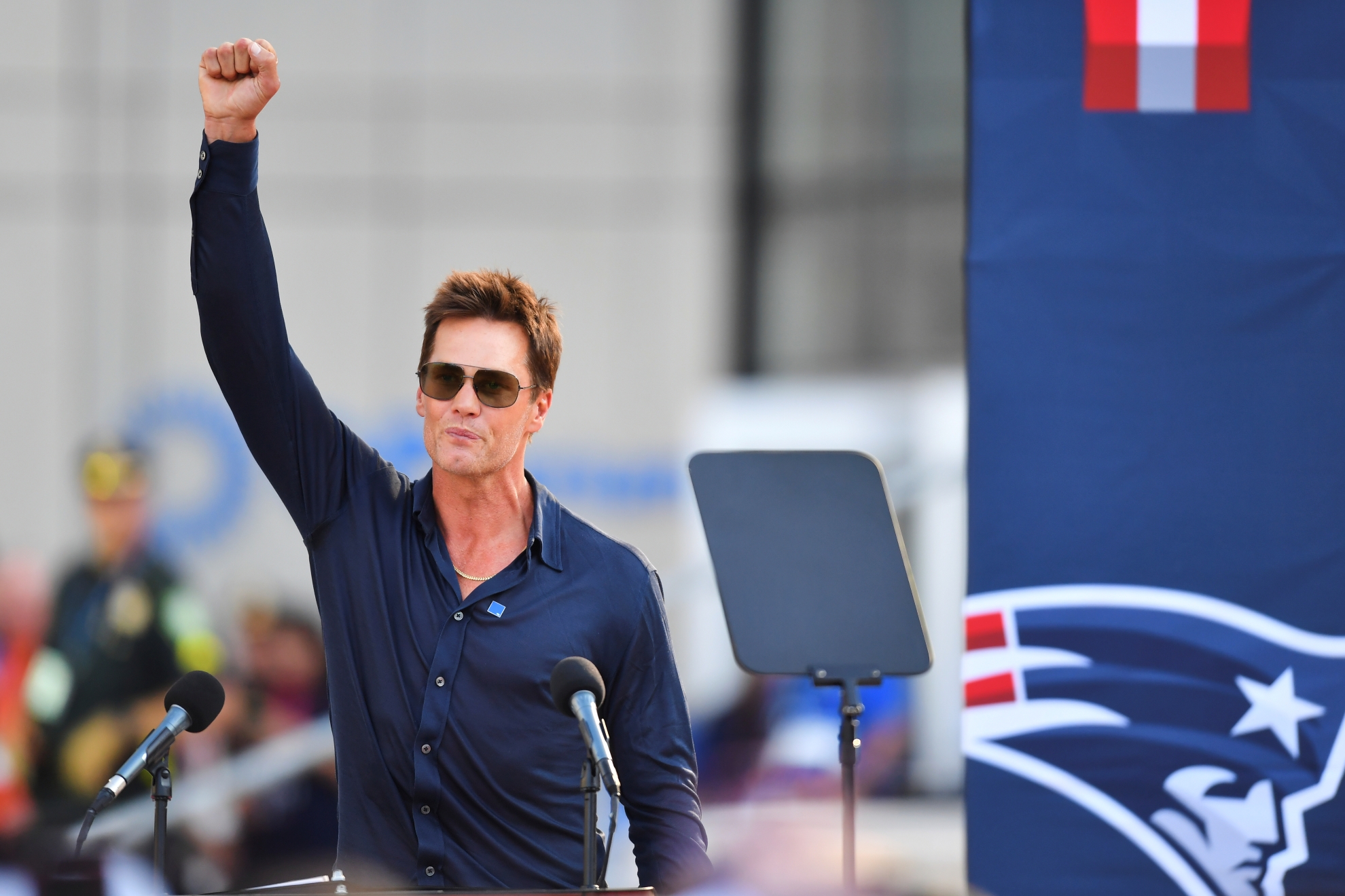 Former New England Patriots quarterback Tom Brady speaks after a bronze statue of himself was unveiled in Patriot Place Plaza