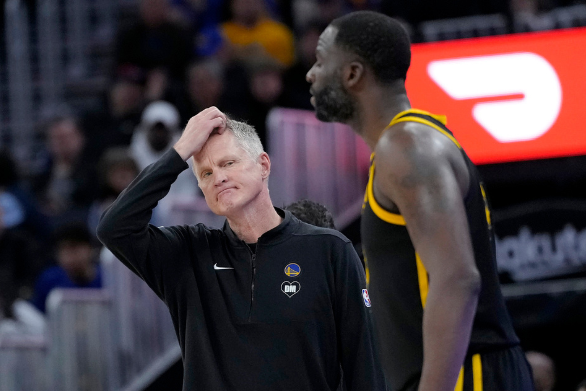 Steve Kerr looks on with disappointment at Draymond Green during the Golden State Warriors' 2025-26 NBA season.