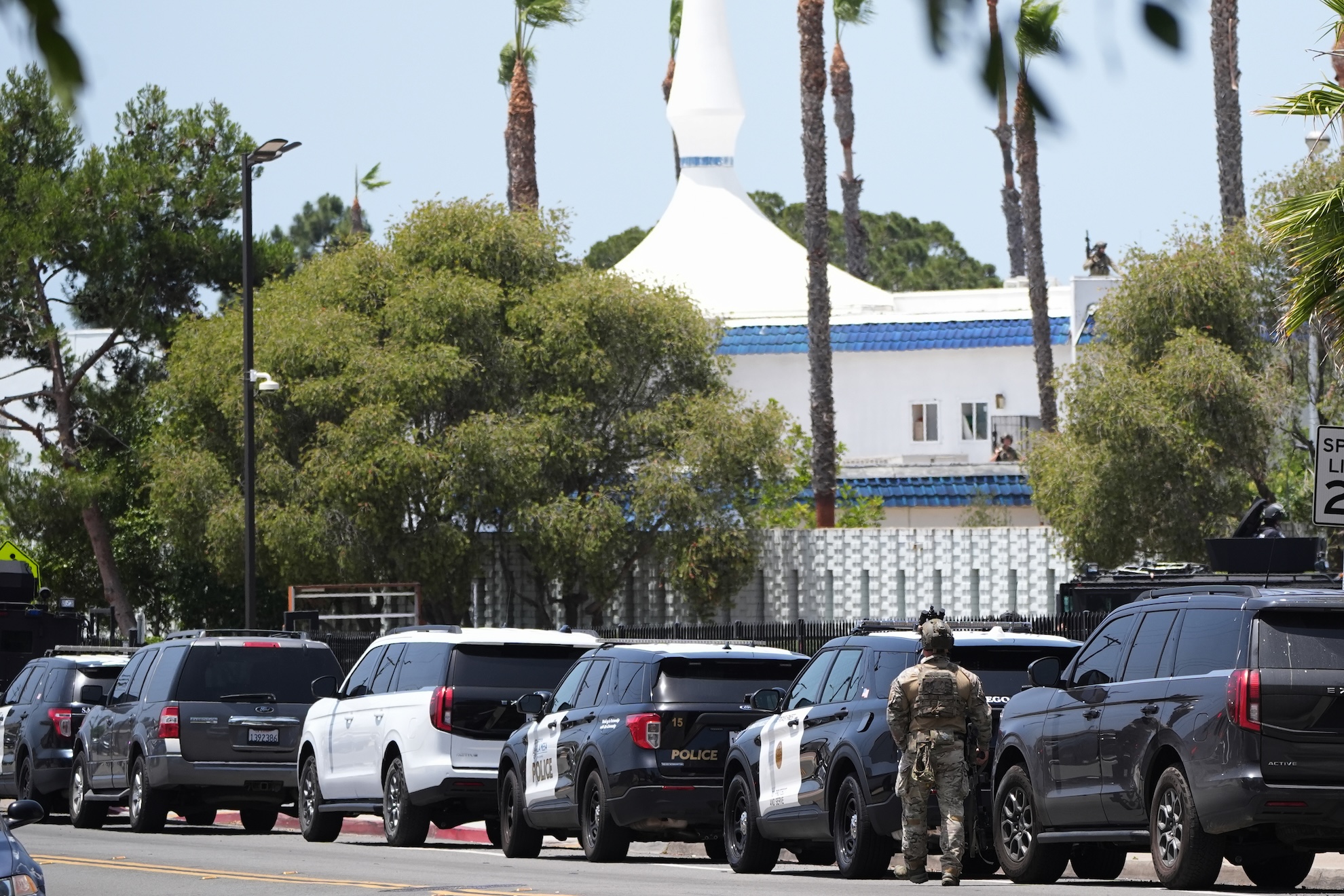 Police stage at the scene of a shooting outside the Islamic Center of San Diego