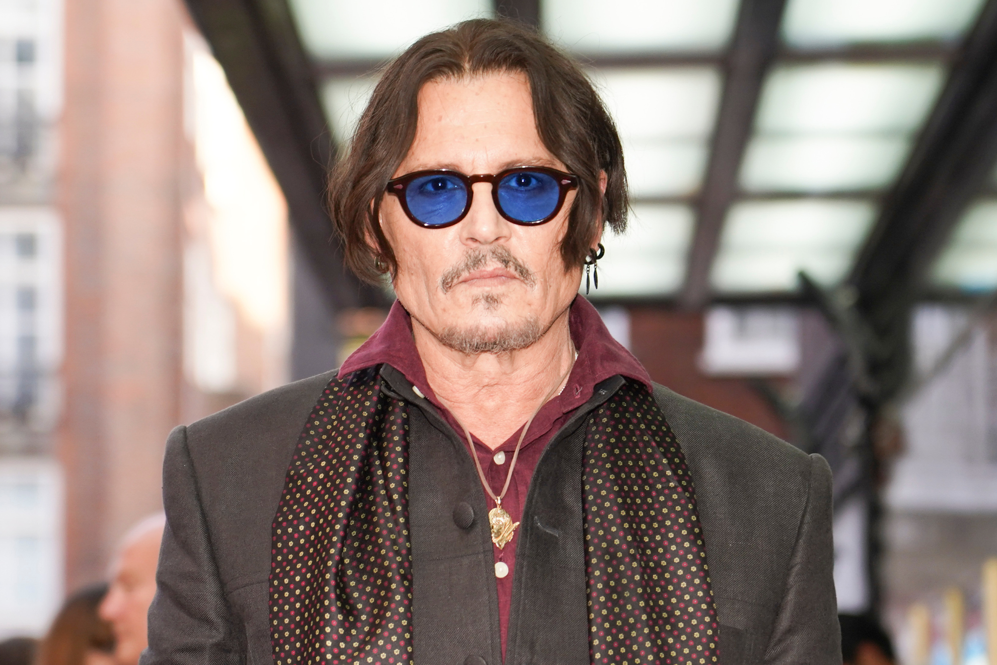 Johnny Depp poses upon arrival at the premiere of the film "Modigliani Three Days On The Wing Of Madness" on Tuesday, July 8, 2025, in London