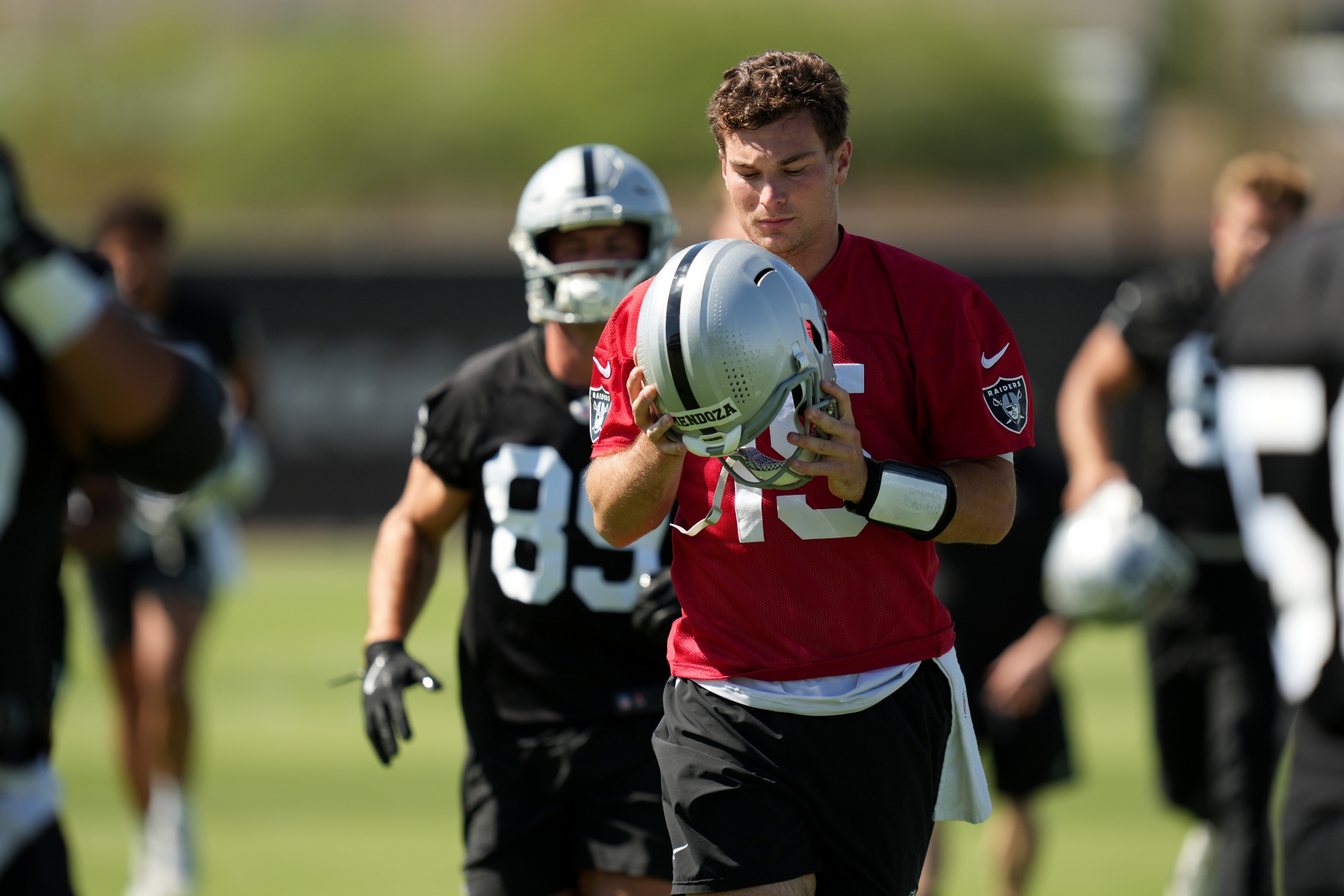Las Vegas Raiders quarterback Fernando Mendoza (15) warms up during the NFL football team's practice