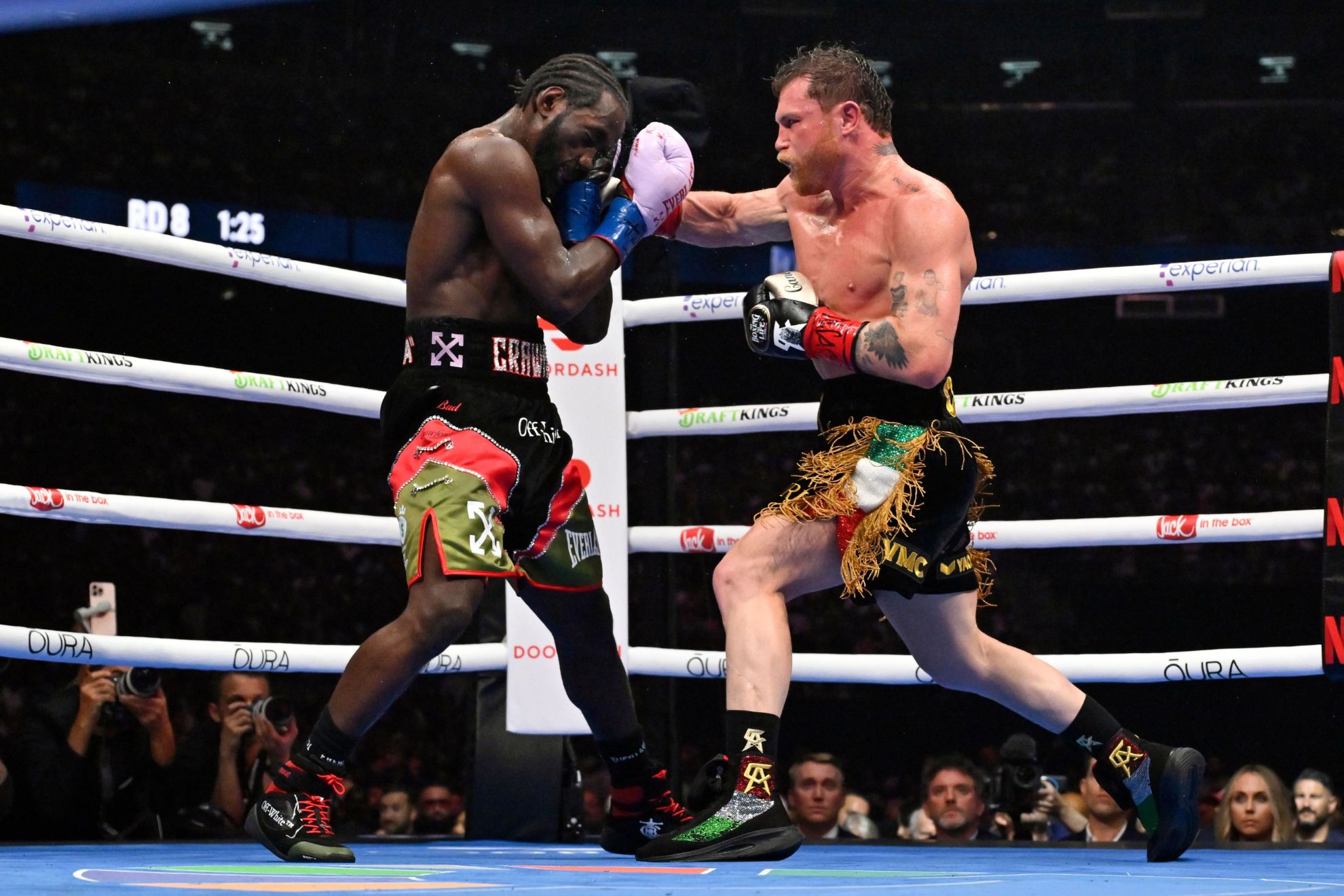 Canelo Alvarez, right, connects with Terence Crawford during an undisputed super middleweight championship boxing