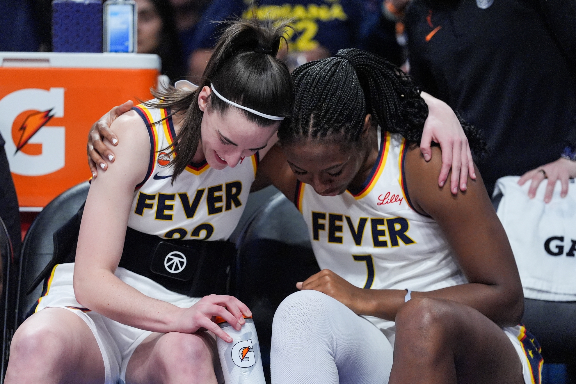 Indiana Fever guard Caitlin Clark (22) and center-forward Aliyah Boston (7) share a moment during a WNBA game against the Los Angeles Sparks