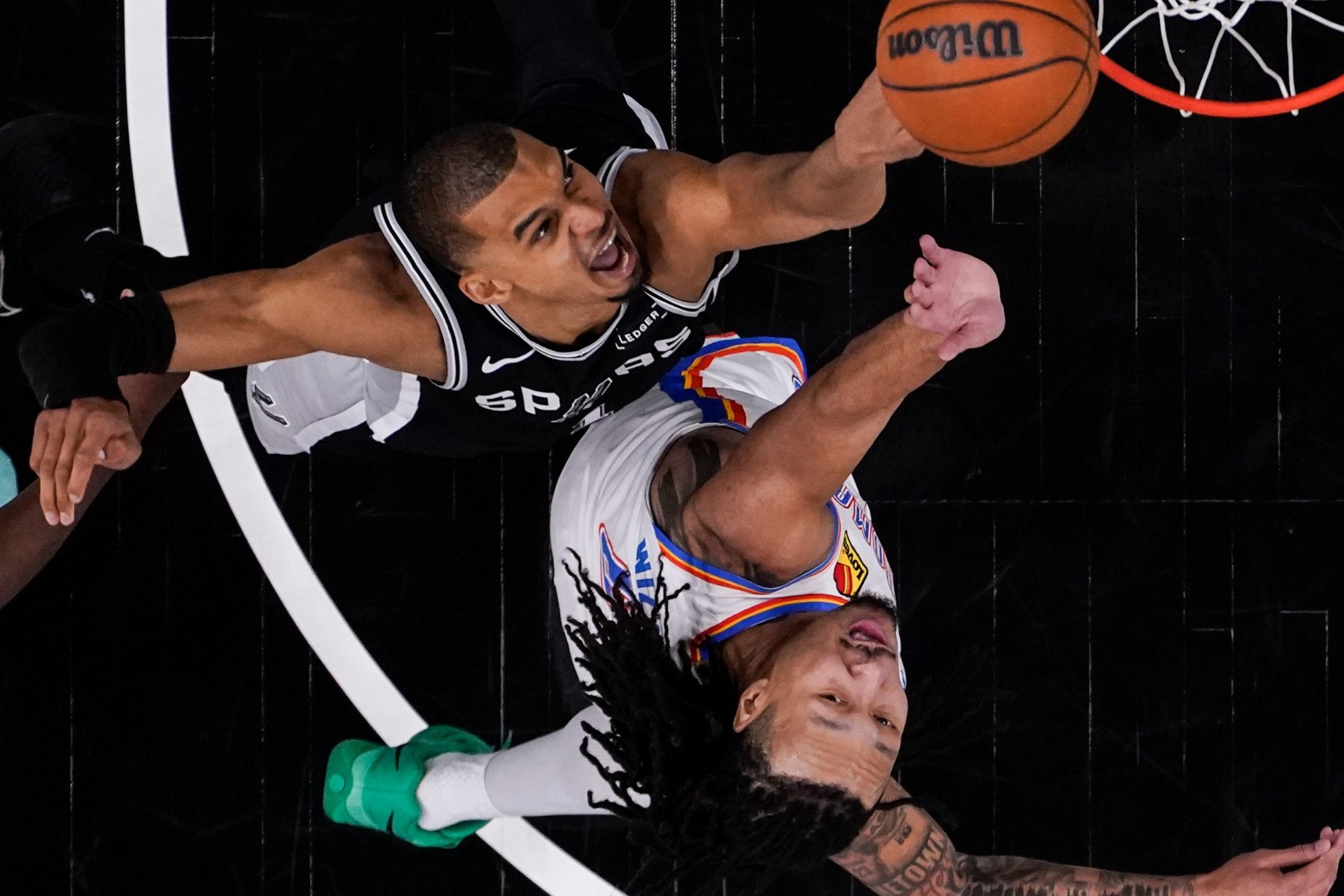 San Antonio Spurs forward Victor Wembanyama (1) shoots against Oklahoma City Thunder forward Jaylin Williams (6).