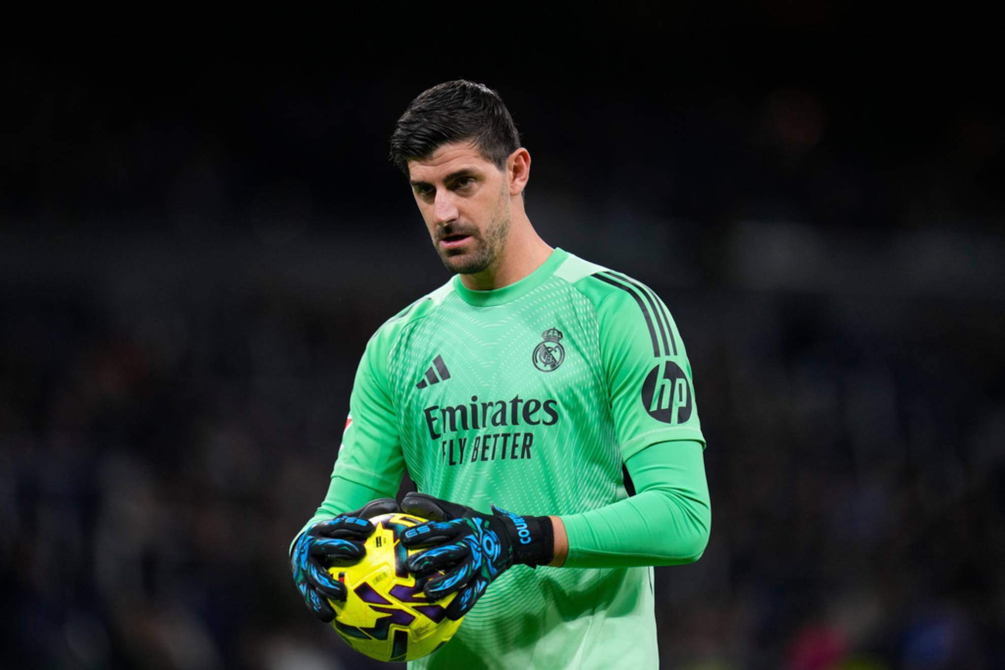 Real Madrid's goalkeeper Thibaut Courtois hold the ball during the Spanish La Liga soccer match between Real Madrid and Sevilla in Madrid.