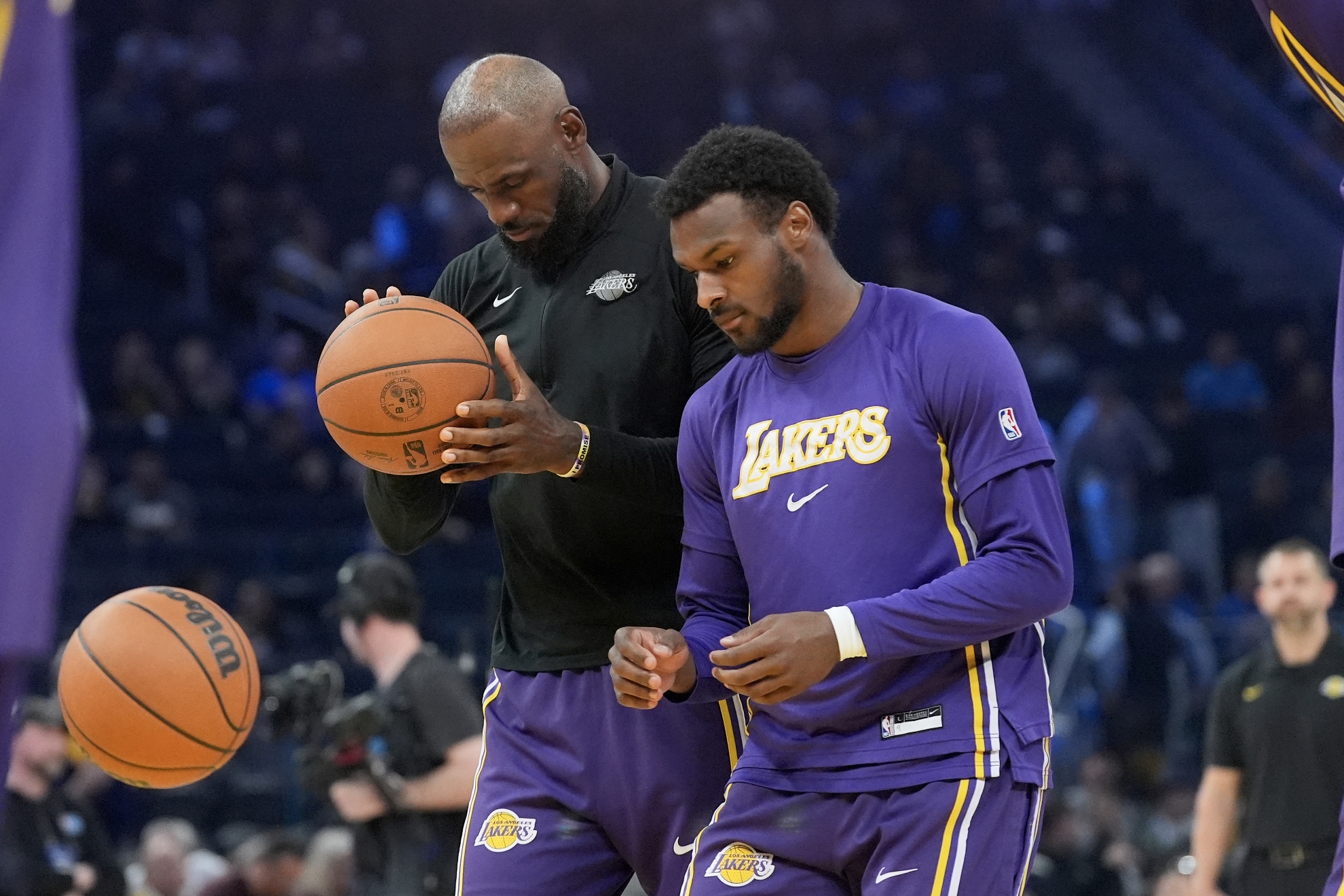 Los Angeles Lakers guard Bronny James (R) and his father, LeBron James LAPRESSE