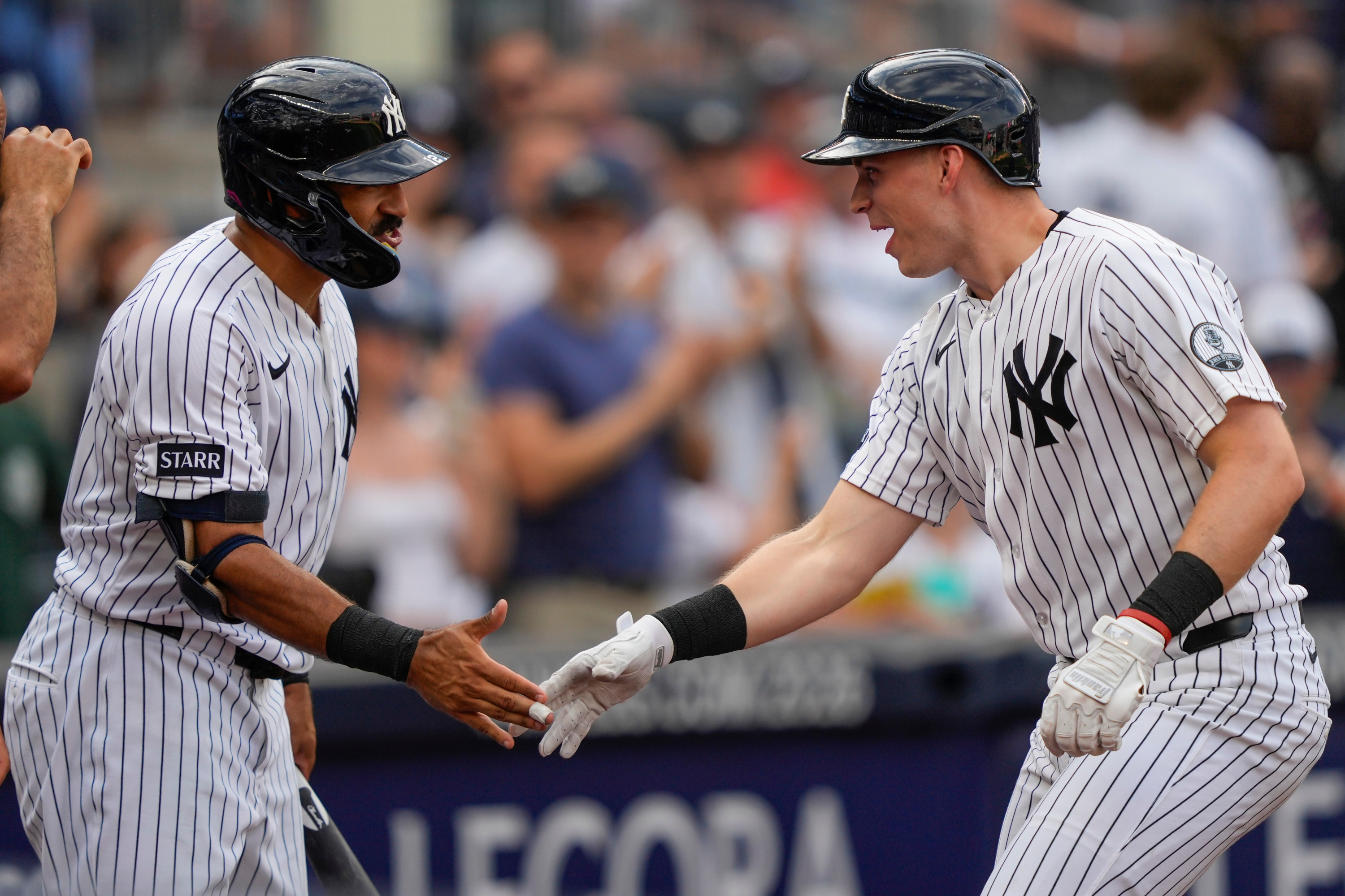 New York Yankees designated hitter Ben Rice, right, celebrates with Trent Grisham, left&nbsp;