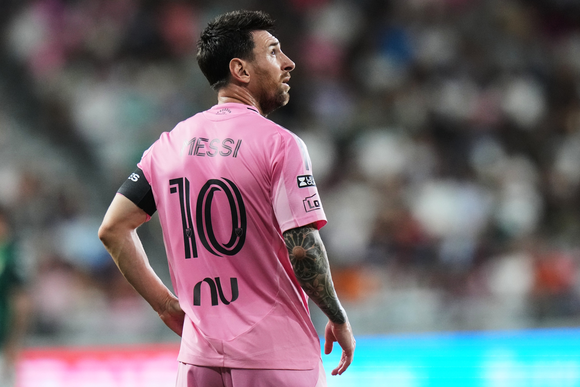 Lionel Messi stands on the field during the Leagues Cup soccer match against Club León.