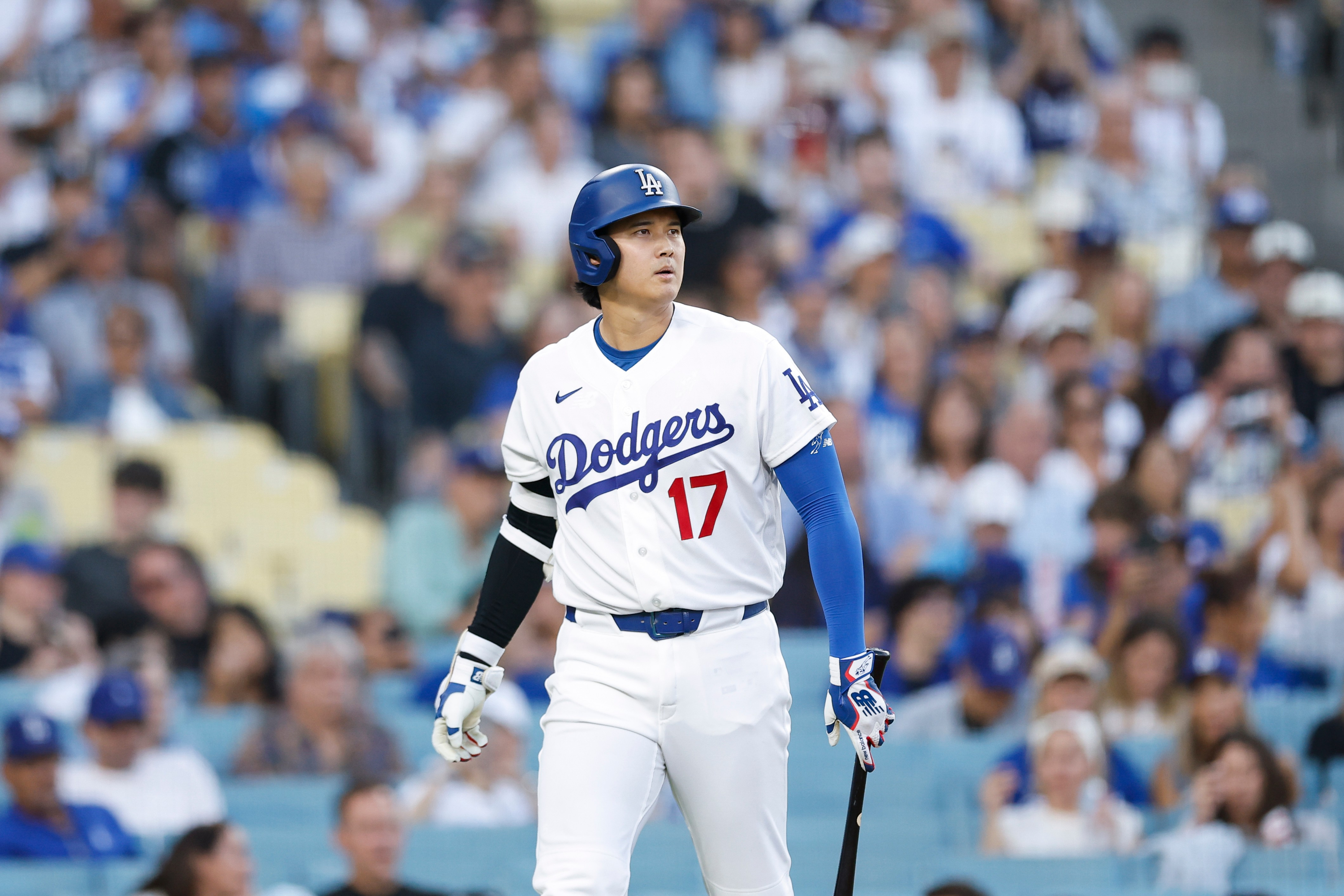 Los Angeles Dodgers designated hitter Shohei Ohtani (17) walks out to the field while at-bat during the first inning of a baseball game against the Kansas City Royals, Tuesday, Aug. 11, 2026, in Los Angeles. (AP Photo/Caroline Brehman) Caroline Brehman