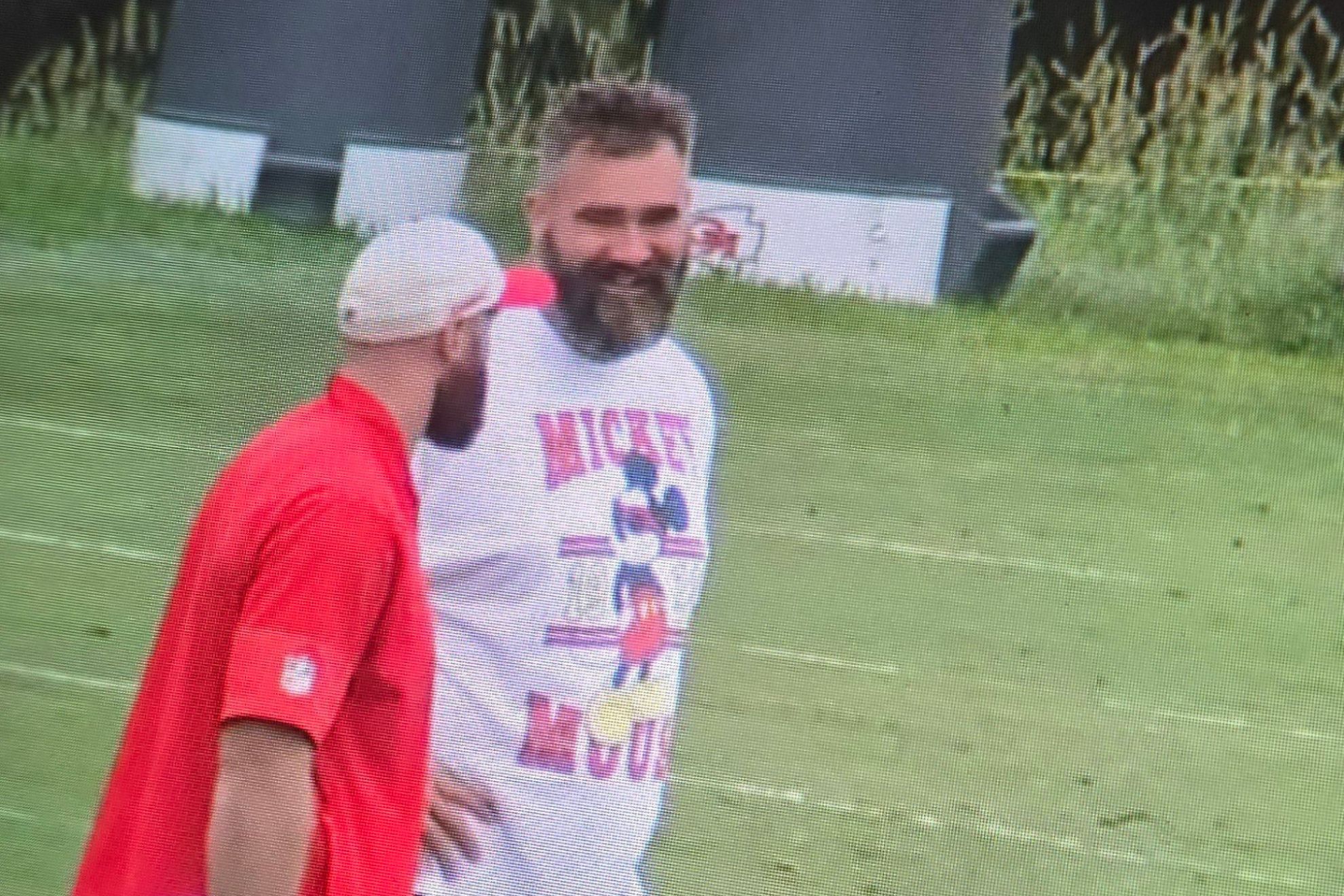 Jason Kelce talks with his brother Travis while visiting Chiefs training camp
