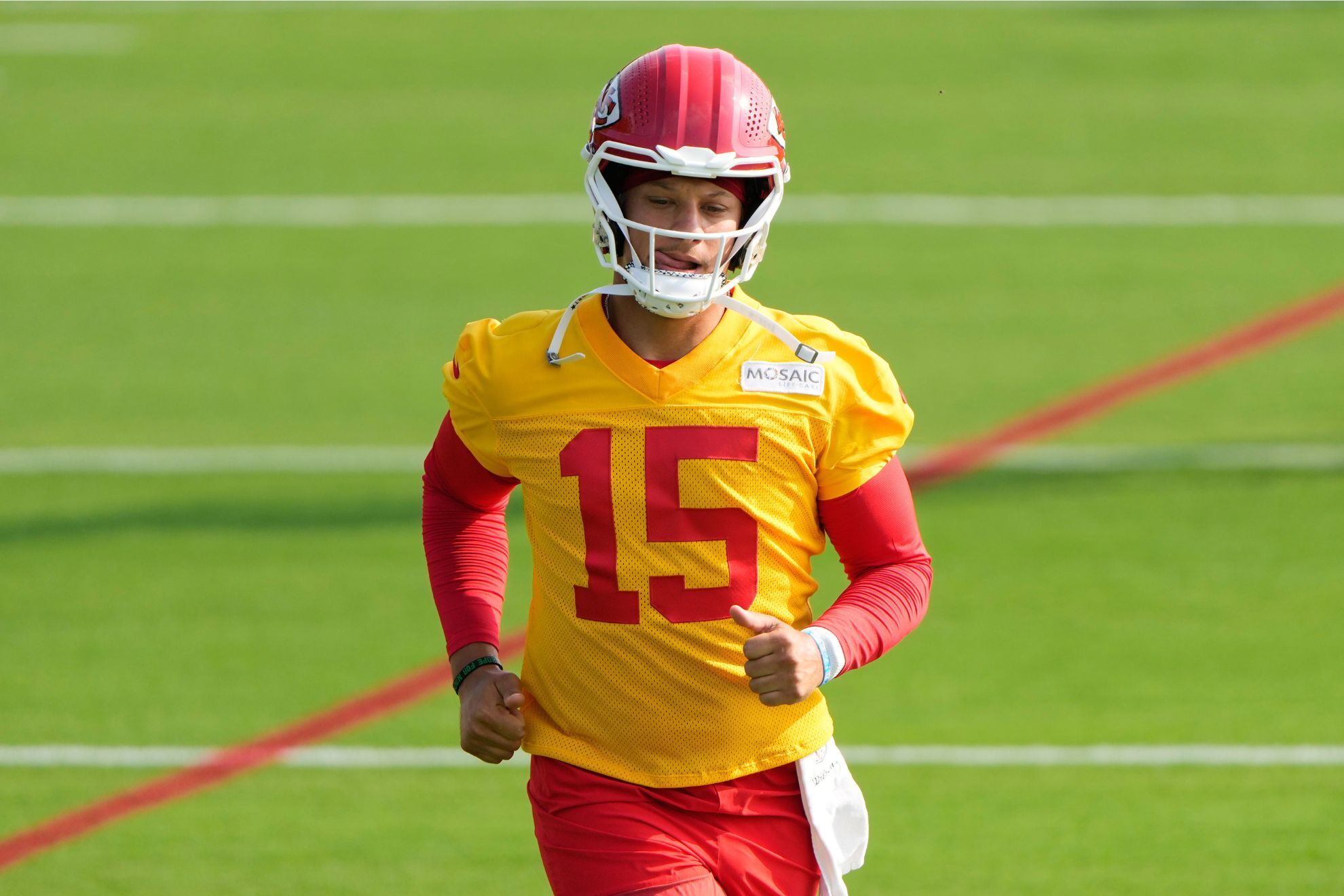 Kansas City Chiefs quarterback Patrick Mahomes runs at NFL football training camp