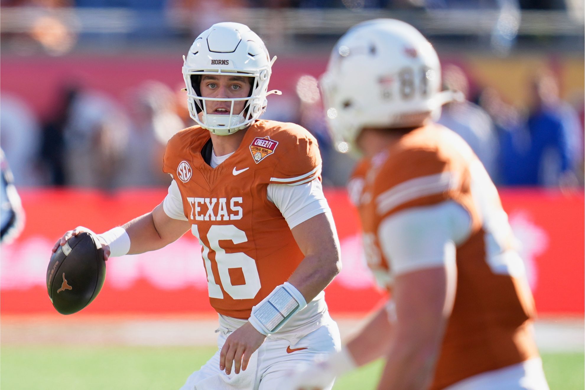 Texas quarterback Arch Manning (16) looks for a receiver during the first half of the Citrus Bowl NCAA college football game