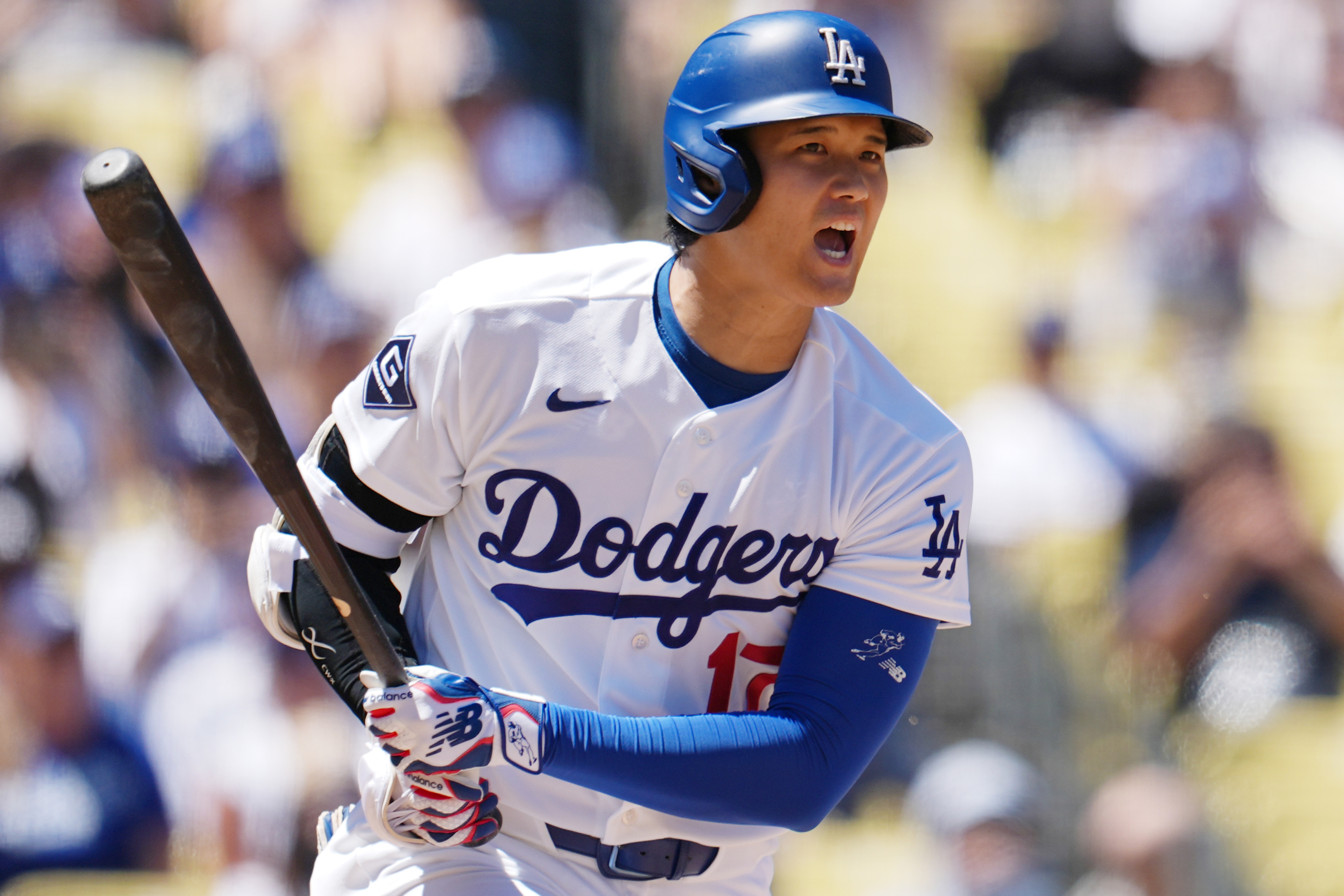 Los Angeles Dodgers' Shohei Ohtani reacts while batting during the first inning of a baseball game against the Pittsburgh Pirates, Sunday, Aug. 23, 2026, in Los Angeles. (AP Photo/Ethan Swope) Ethan Swope