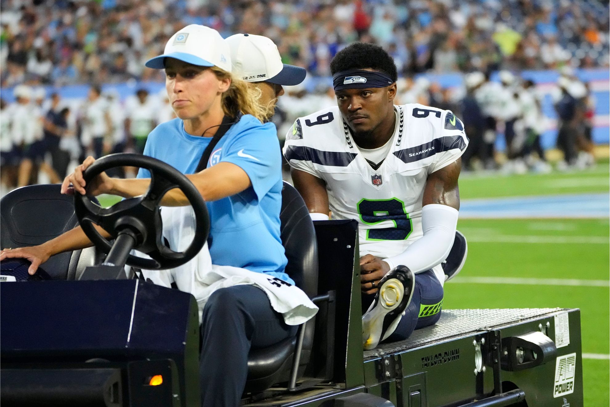 Seattle Seahawks defensive back Bud Clark (9) is carted off the field after getting injured during the first half of a preseason NFL football game