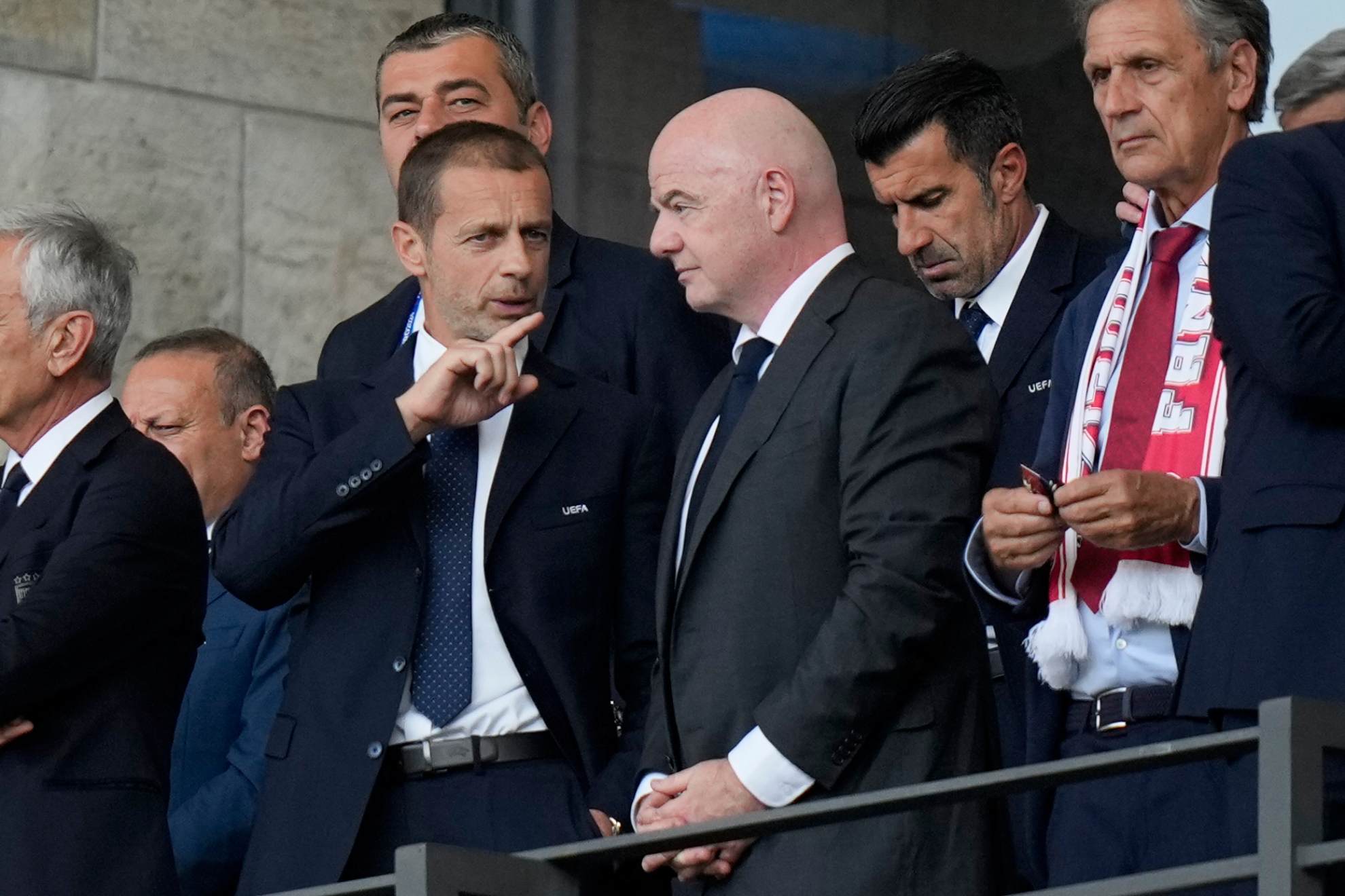 UEFA President Aleksander Ceferin talks to FIFA President Gianni Infantino before a round of sixteen match between Switzerland and Italy at the Euro Matthias Schrader