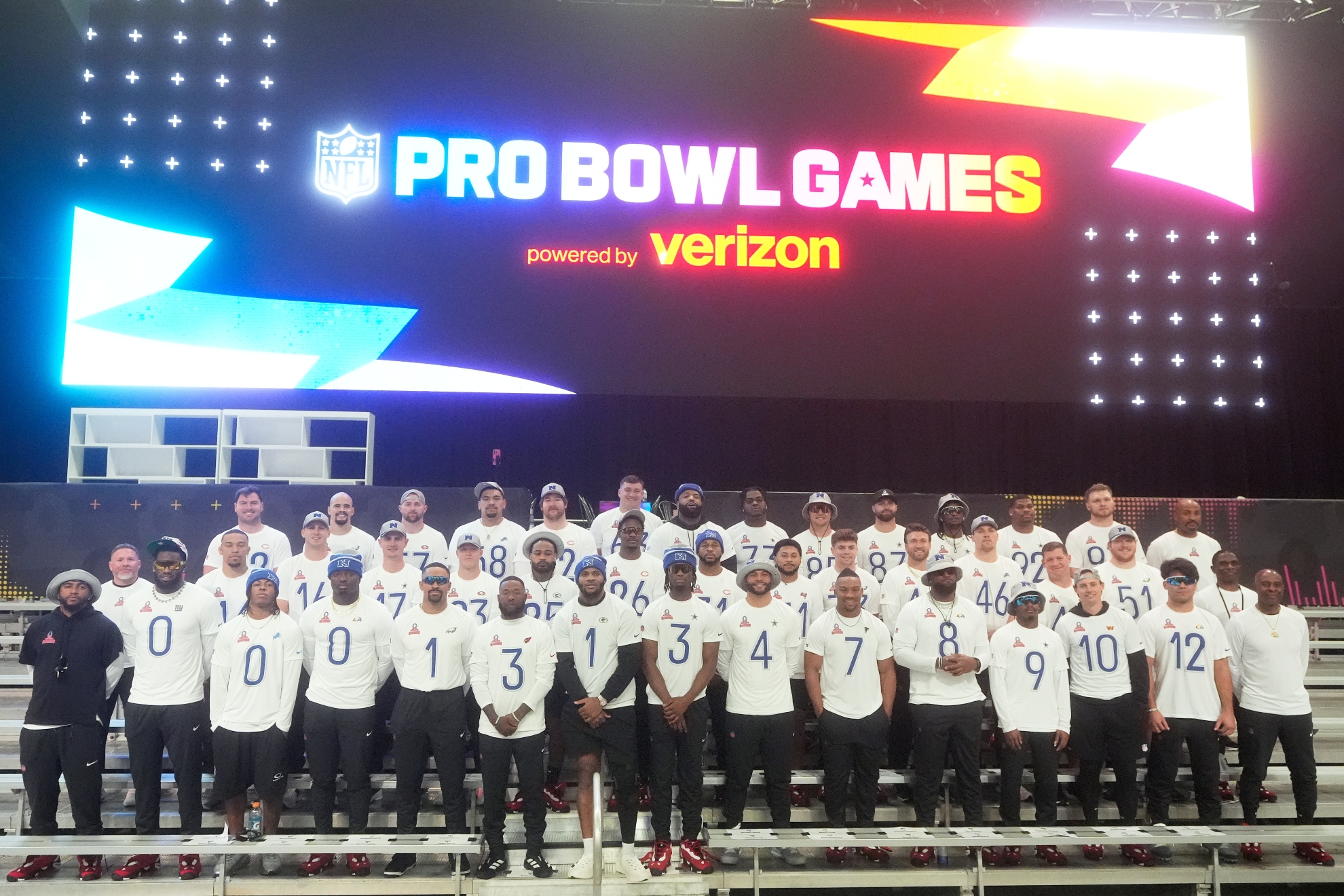 NFC head coach Jerry Rice, bottom right, and players stand for team photos before NFL Pro Bowl Games practice in San Francisco