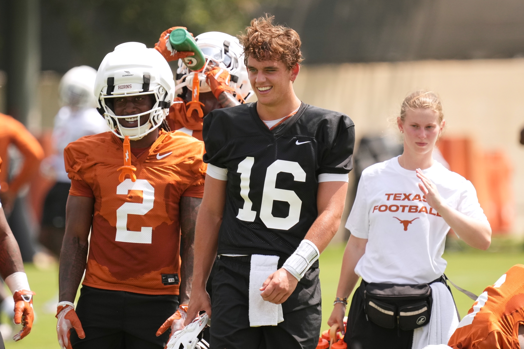 Texas quarterback Arch Manning (16) and running back Hollywood Smothers (2) take part in an NCAA college preseason football camp