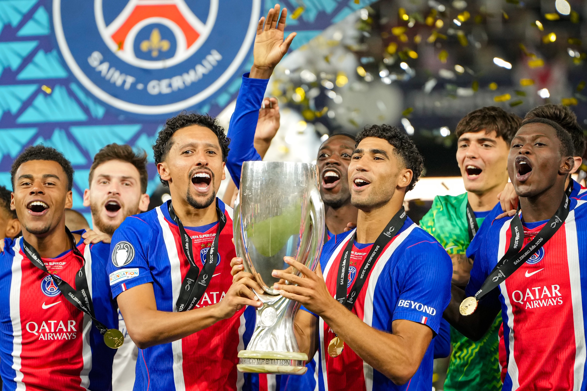 Marquinhos and Achraf Hakimi lift the trophy at the end of the UEFA Super Cup soccer match. LAPRESSE