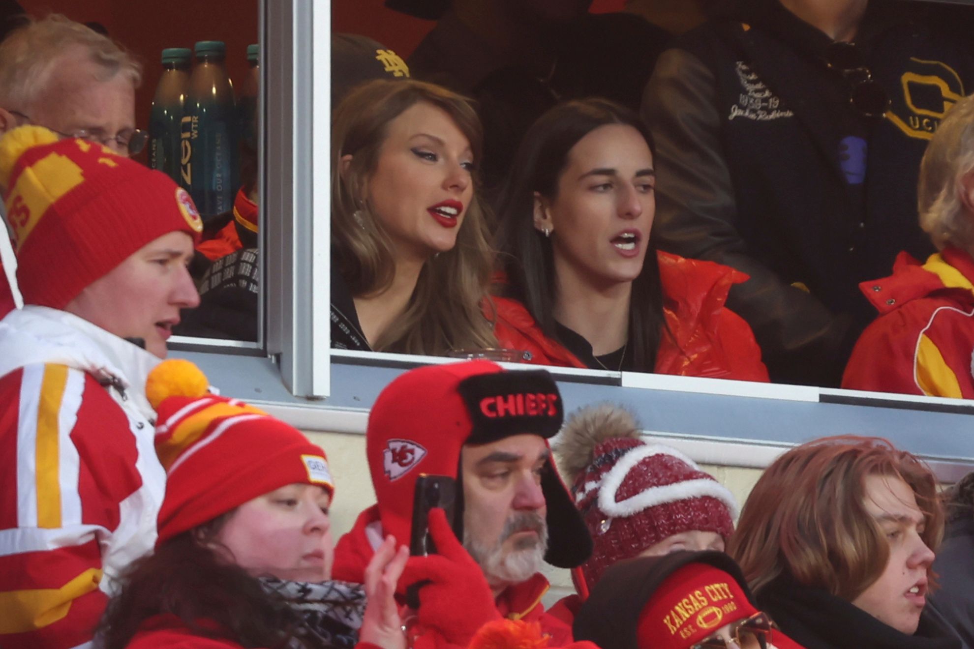 Taylor Swift watches from a suite with basketball player Caitlin Clark, right, during the second half of an NFL football AFC divisional playoff game