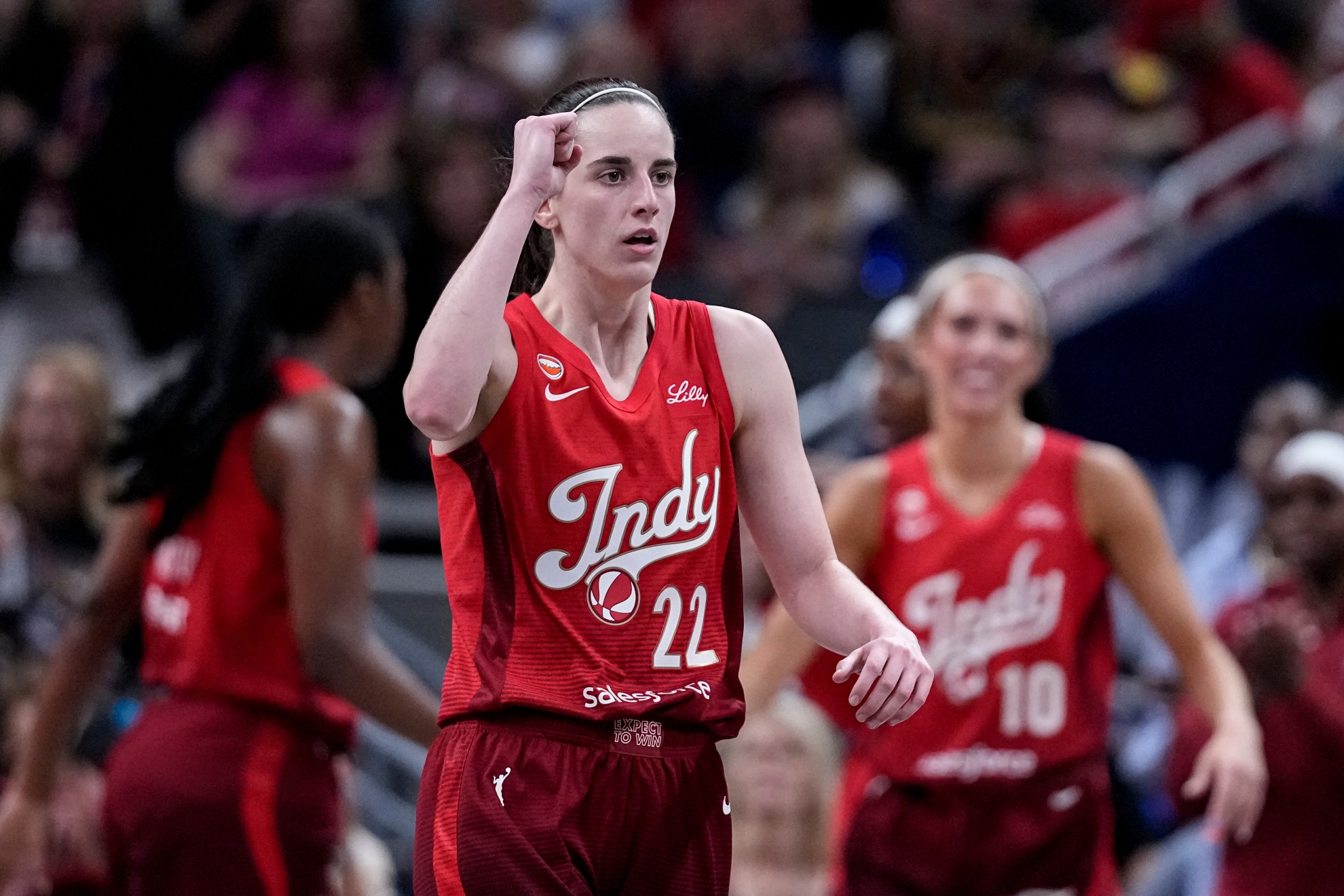 Indiana Fever guard Caitlin Clark (22) celebrates in a WNBA game against the Dallas Wings in Indianapolis