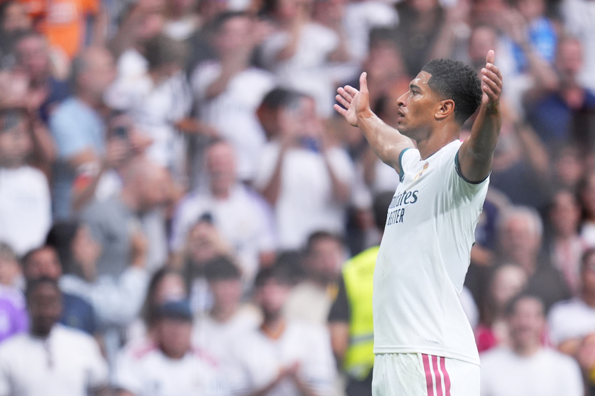 Real Madrid's Jude Bellingham celebrates after scoring his sides first goal during the La Liga soccer match between Real Madrid and Malaga in Madrid. Manu Fernandez