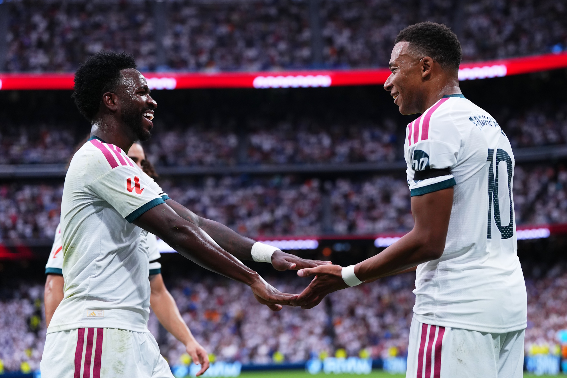 Kylian Mbappe, right, celebrates with Vinicius Junior after scoring. LAPRESSE