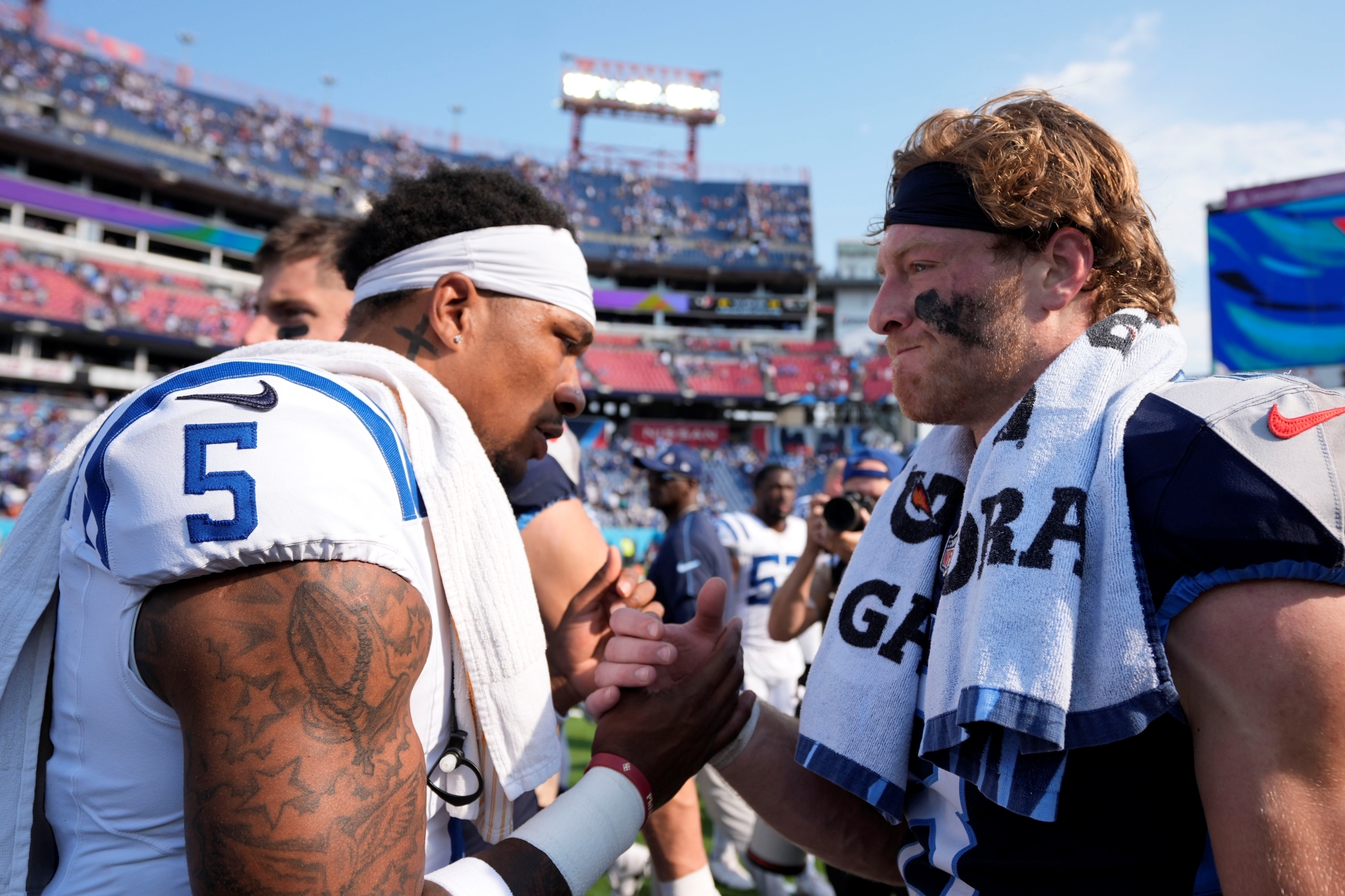 Indianapolis Colts quarterback Anthony Richardson (5) and Tennessee Titans quarterback Will Levis (8) shake hands