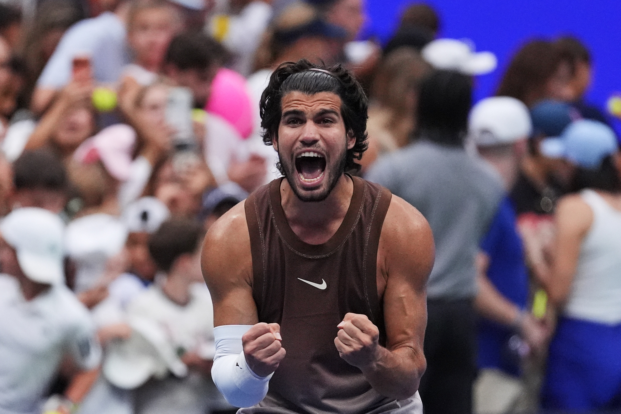 Carlos Alcaraz, of Spain, celebrates winning a match against Roman Safiullin, of Russia.