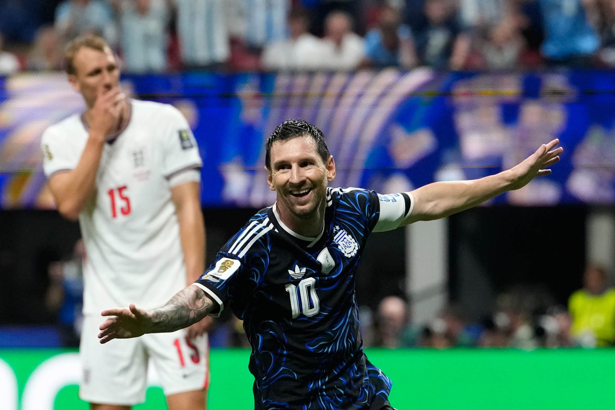 Argentina's Lionel Messi celebrates after teammate Enzo Fernandez scored their side's first goal during the World Cup semifinal soccer match between England and Argentina in Atlanta. Rebecca Blackwell