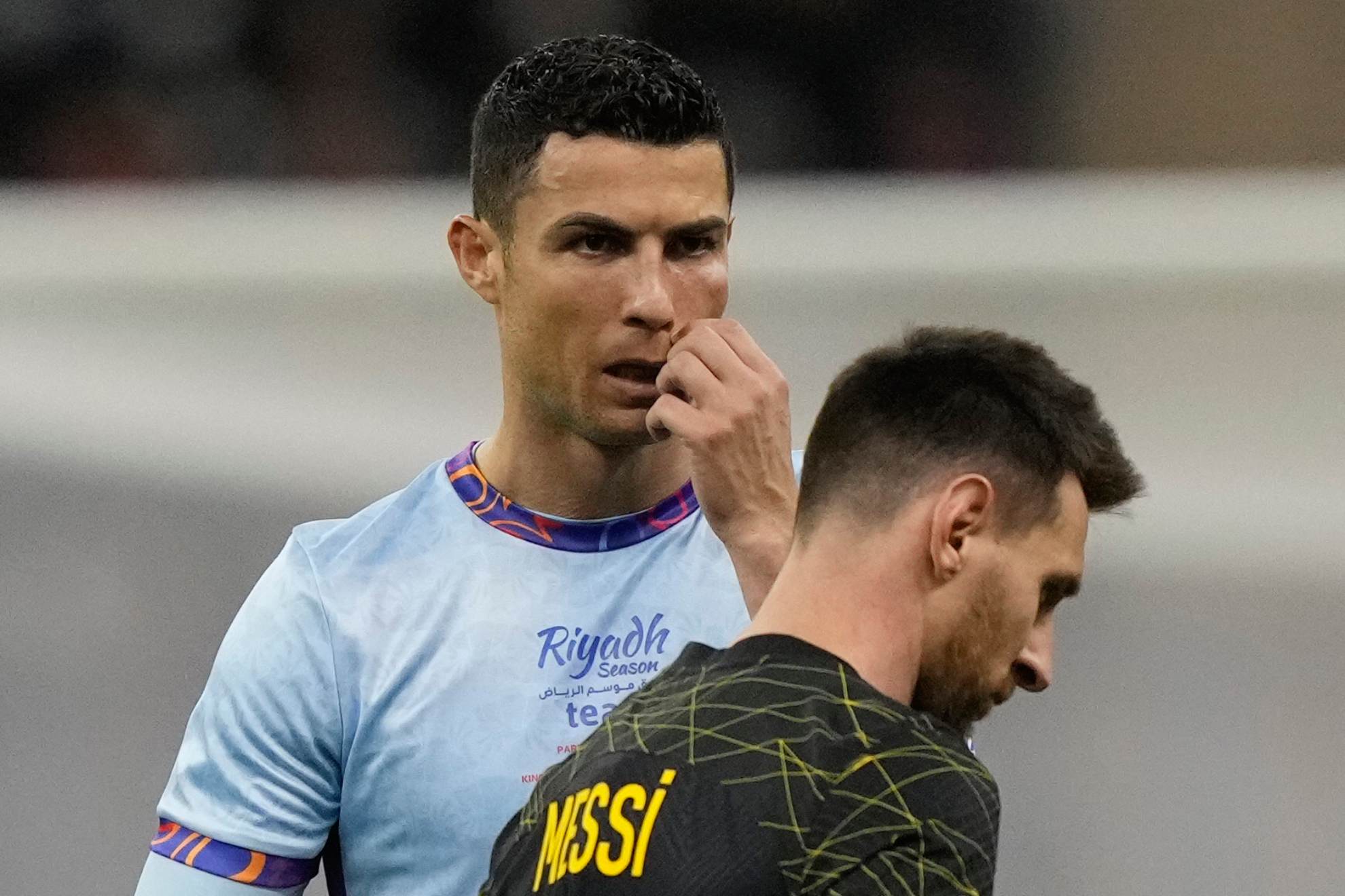 Cristiano Ronaldo and Lionel Messi during a friendly soccer match, at the King Saud University Stadium, in Riyadh, Saudi Arabia. Hussein Malla