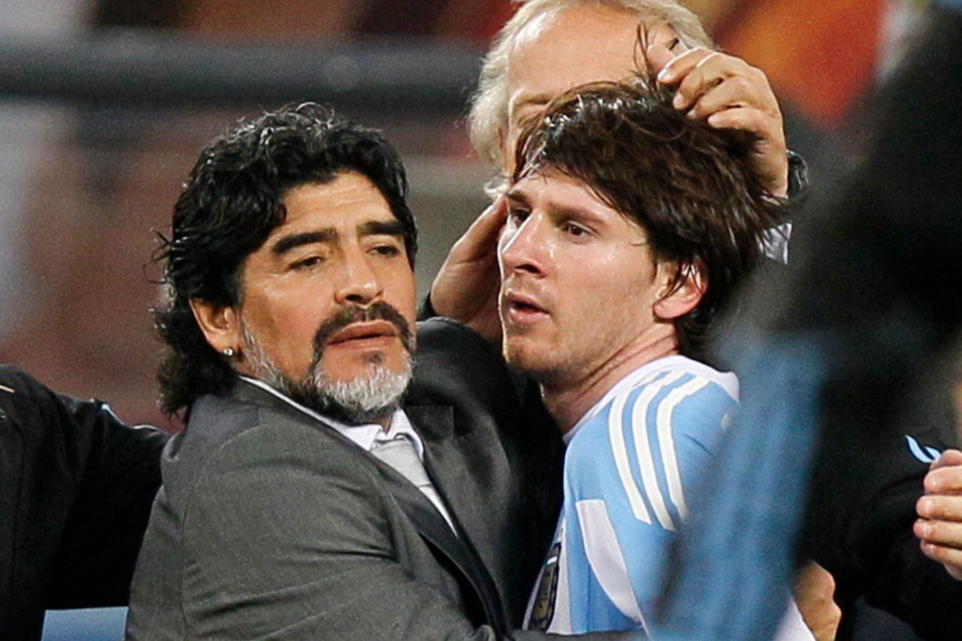 Diego Maradona embraces a young Lionel Messi during the 2010 World Cup in South Africa