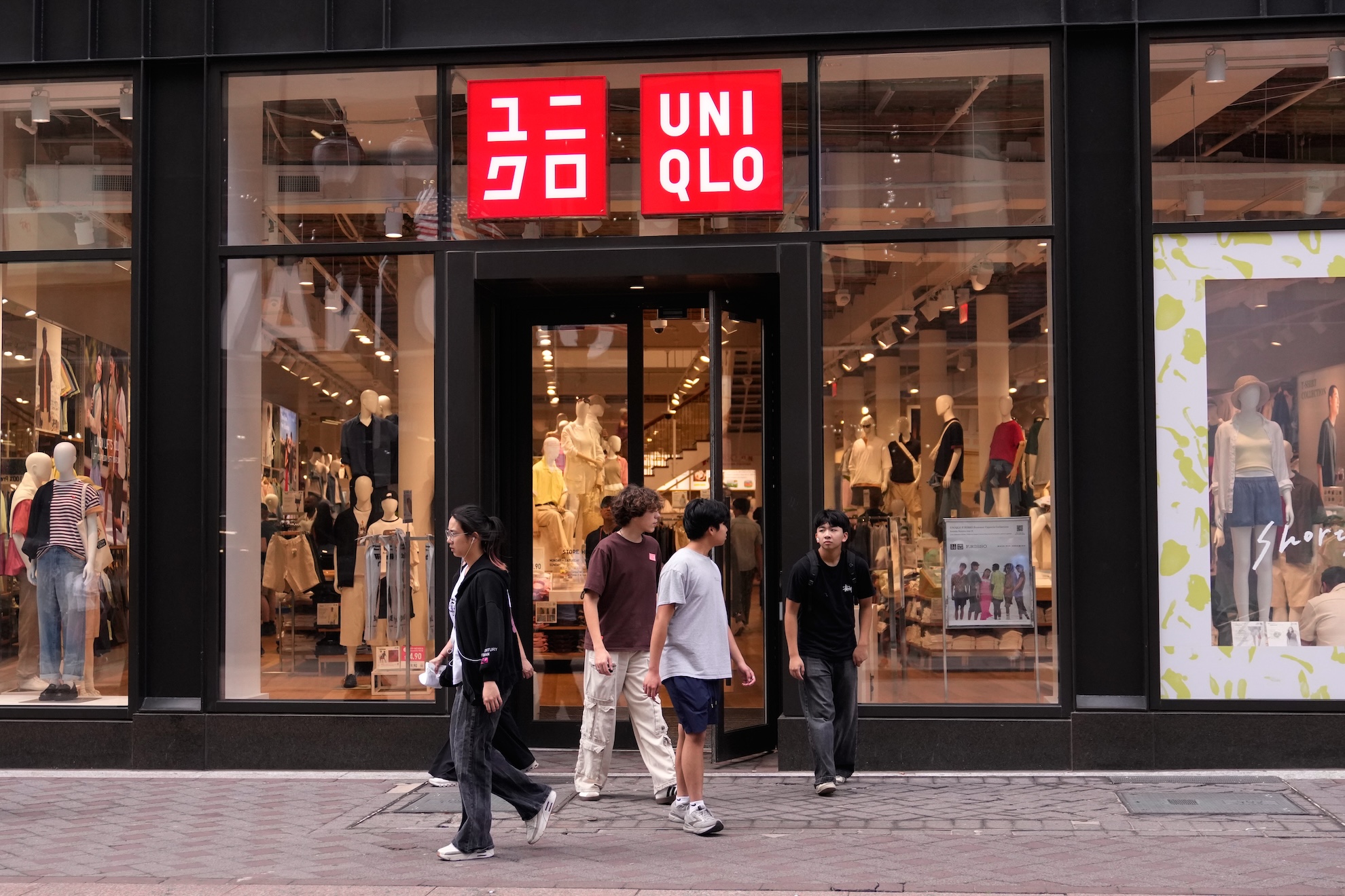 Shoppers leave a UNIQLO store, Wednesday, June 24, 2026, in Boston. (AP Photo/Charles Krupa) Charles Krupa