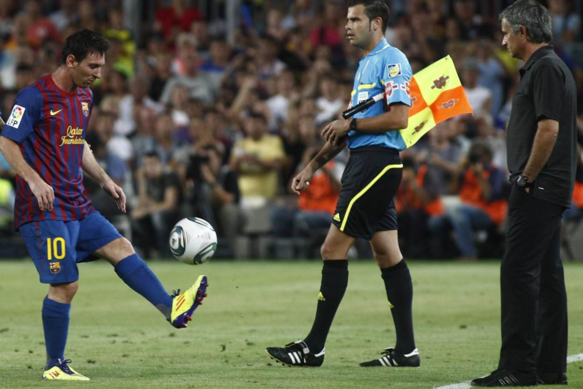 Lionel Messi and José Mourinho during a Clásico between Barcelona and Real Madrid in 2011