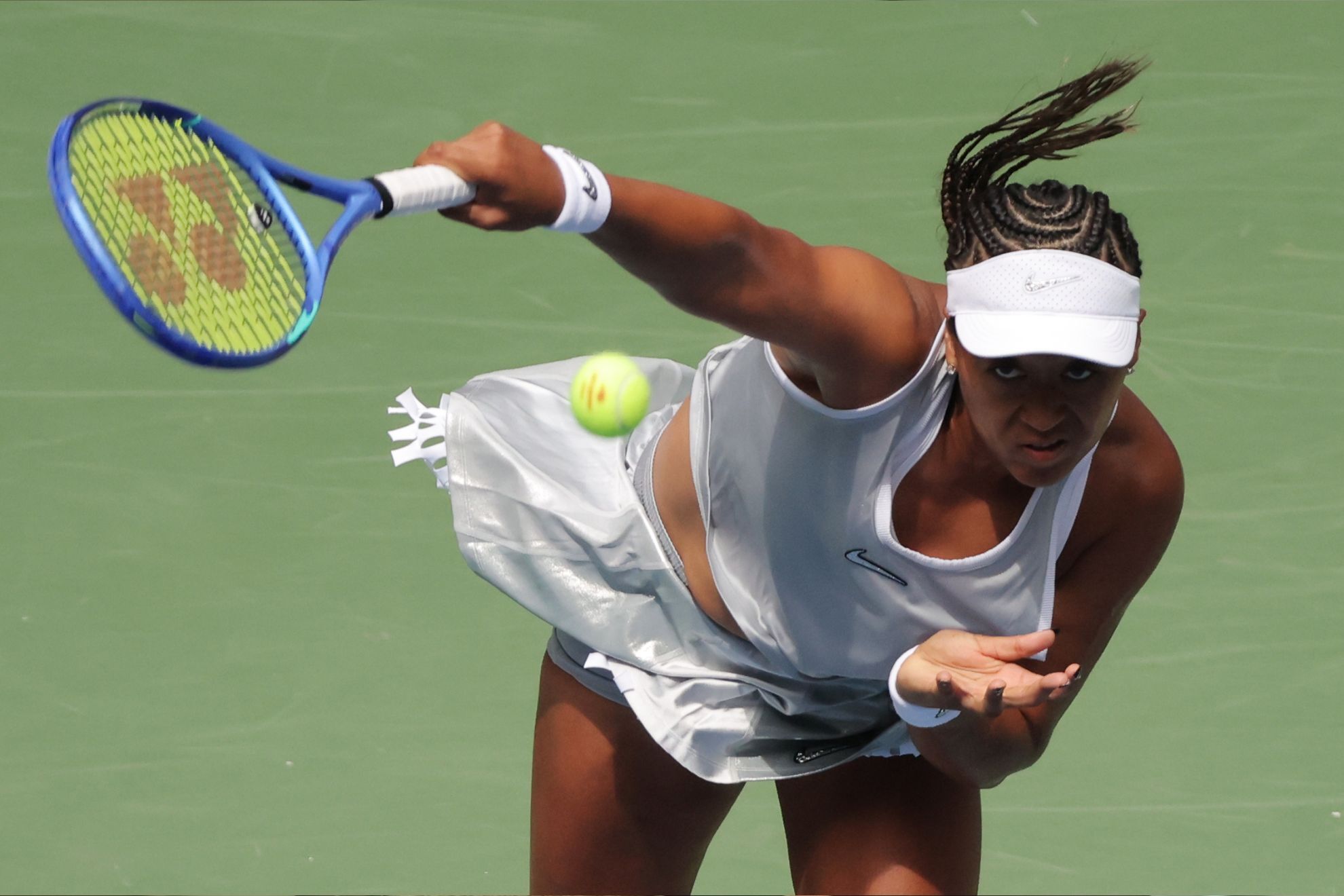 Naomi Osaka, of Japan, serves the ball to Katerina Siniakova, of the Czech Republic, during the second round of the U.S. Open