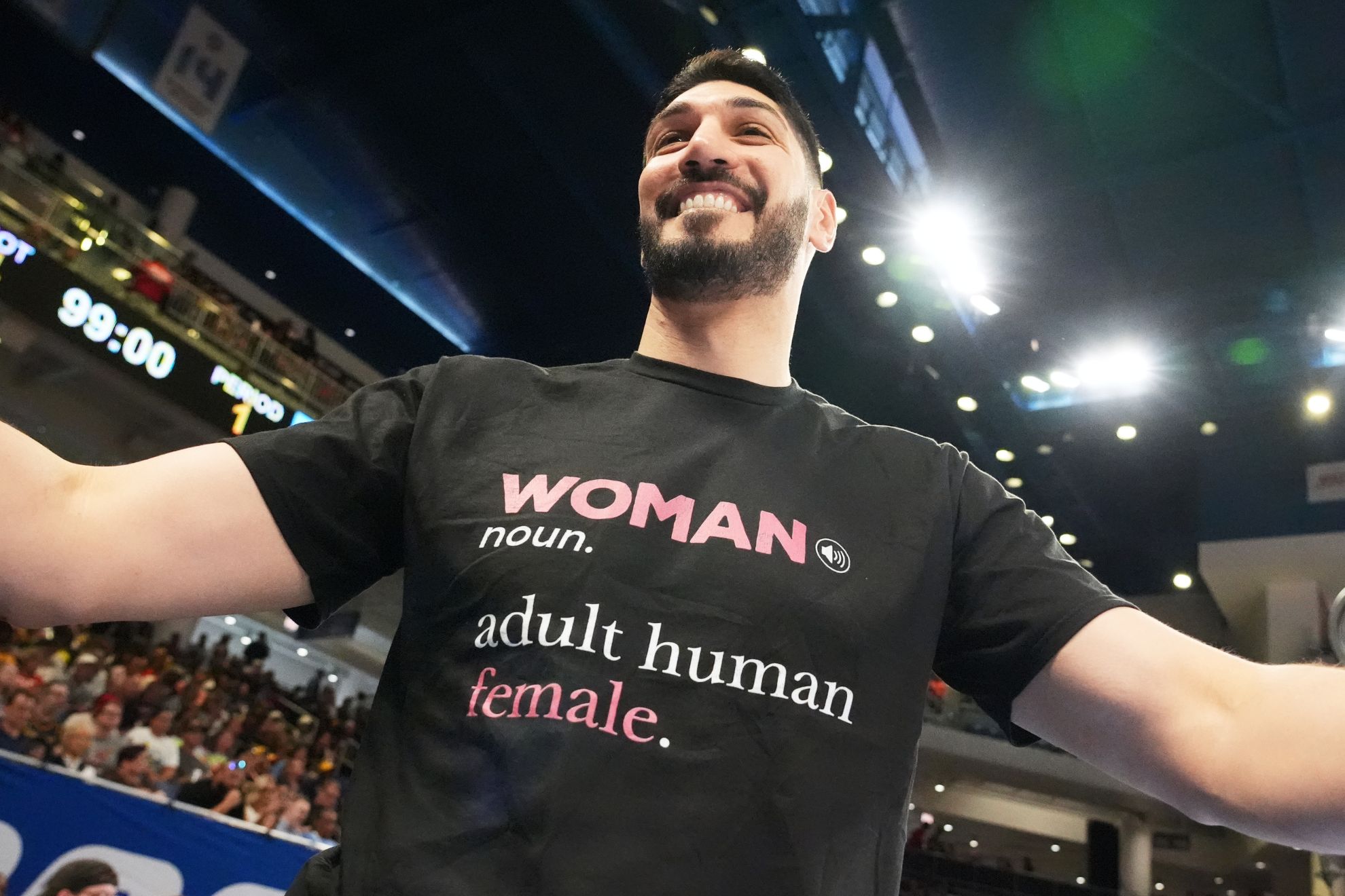 Former NBA center Enes Kanter Freedom greets a friend before a WNBA basketball game between the Indiana Fever and the Chicago Sky, Sunday, Aug. 23, 2026, in Chicago. (AP Photo/Nam Y. Huh)