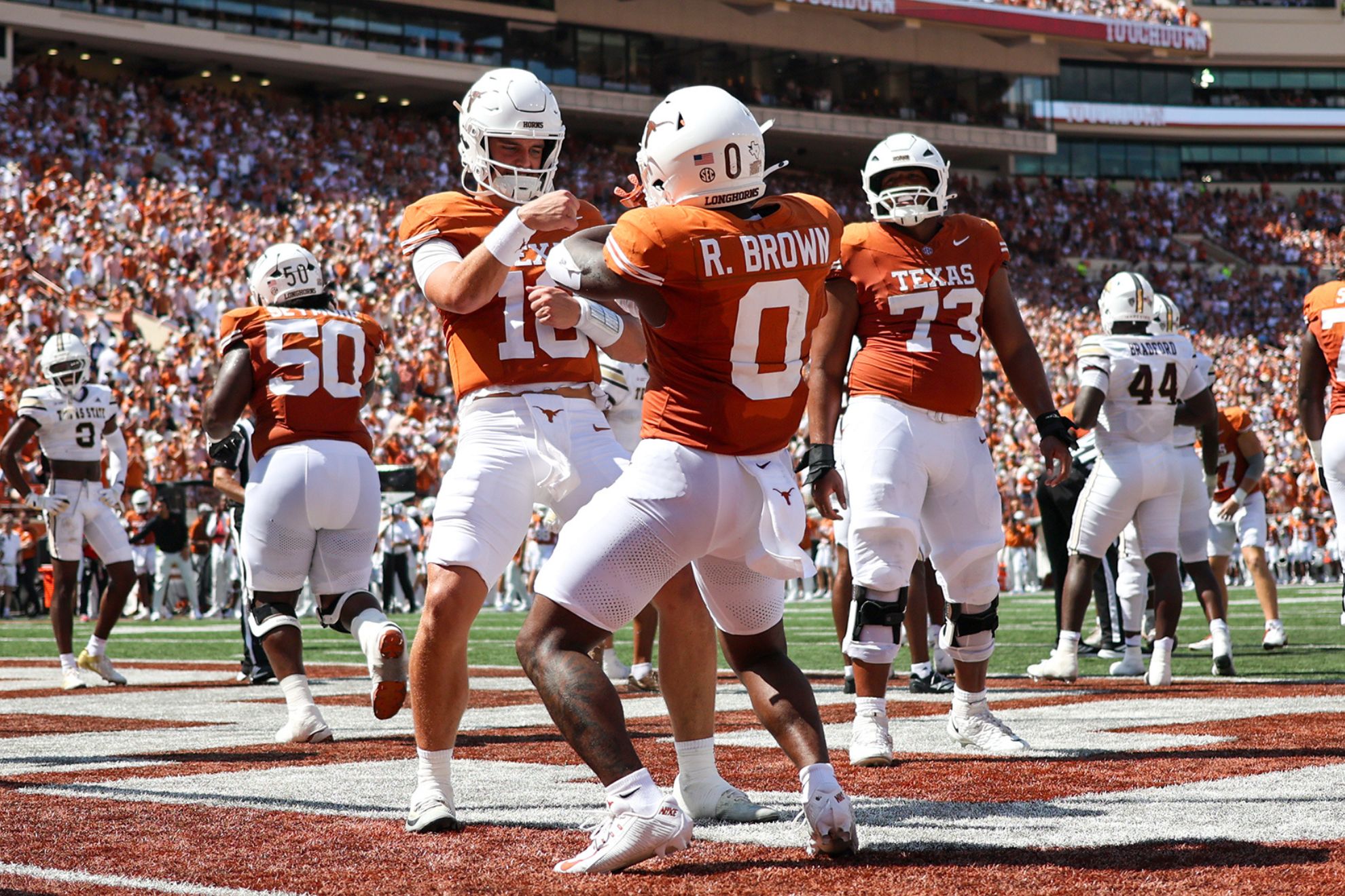 Texas quarterback Arch Manning, left, and running back Raleek Brown (0). Stephen Spillman