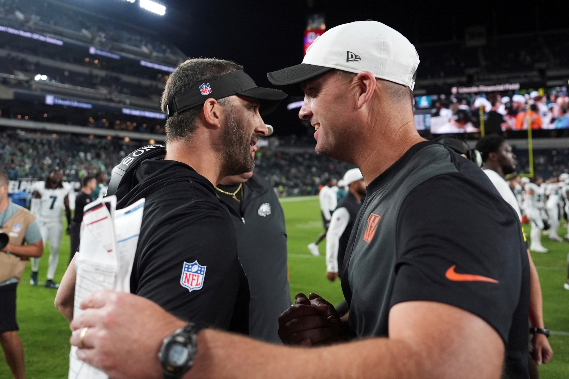 Cincinnati Bengals head coach Zac Taylor, right, greets Philadelphia Eagles head coach Nick Sirianni