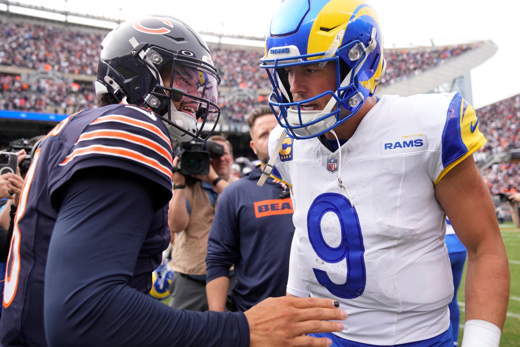 Chicago Bears quarterback Caleb Williams, left, and Los Angeles Rams quarterback Matthew Stafford talk